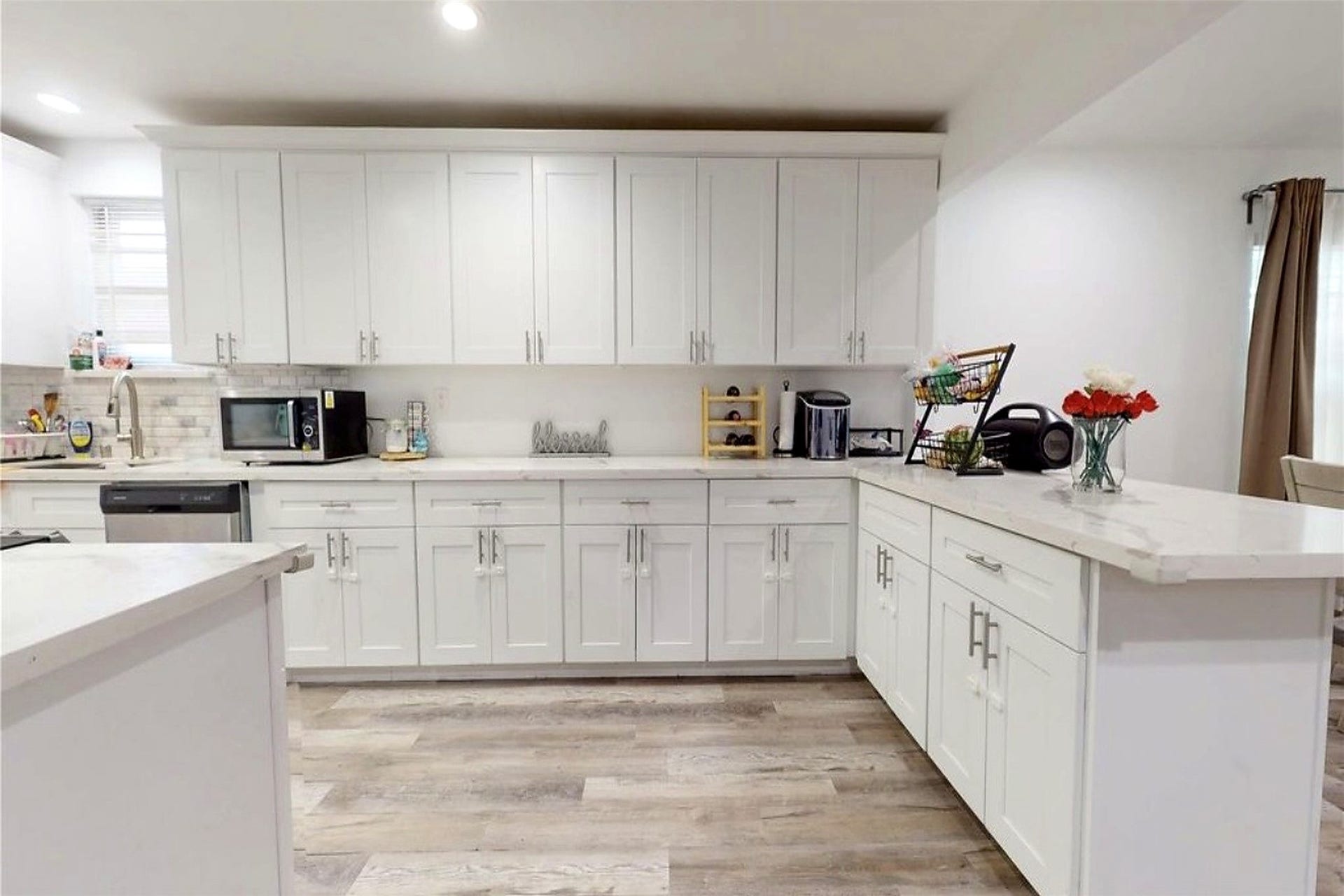 827 Dondell Street, Channelview, TX 77530 827 Dondell, Large kitchen with tall white cabinetry and great for storage, recessed lighting, modern hardware, stainless steel appliances and quartz countertops