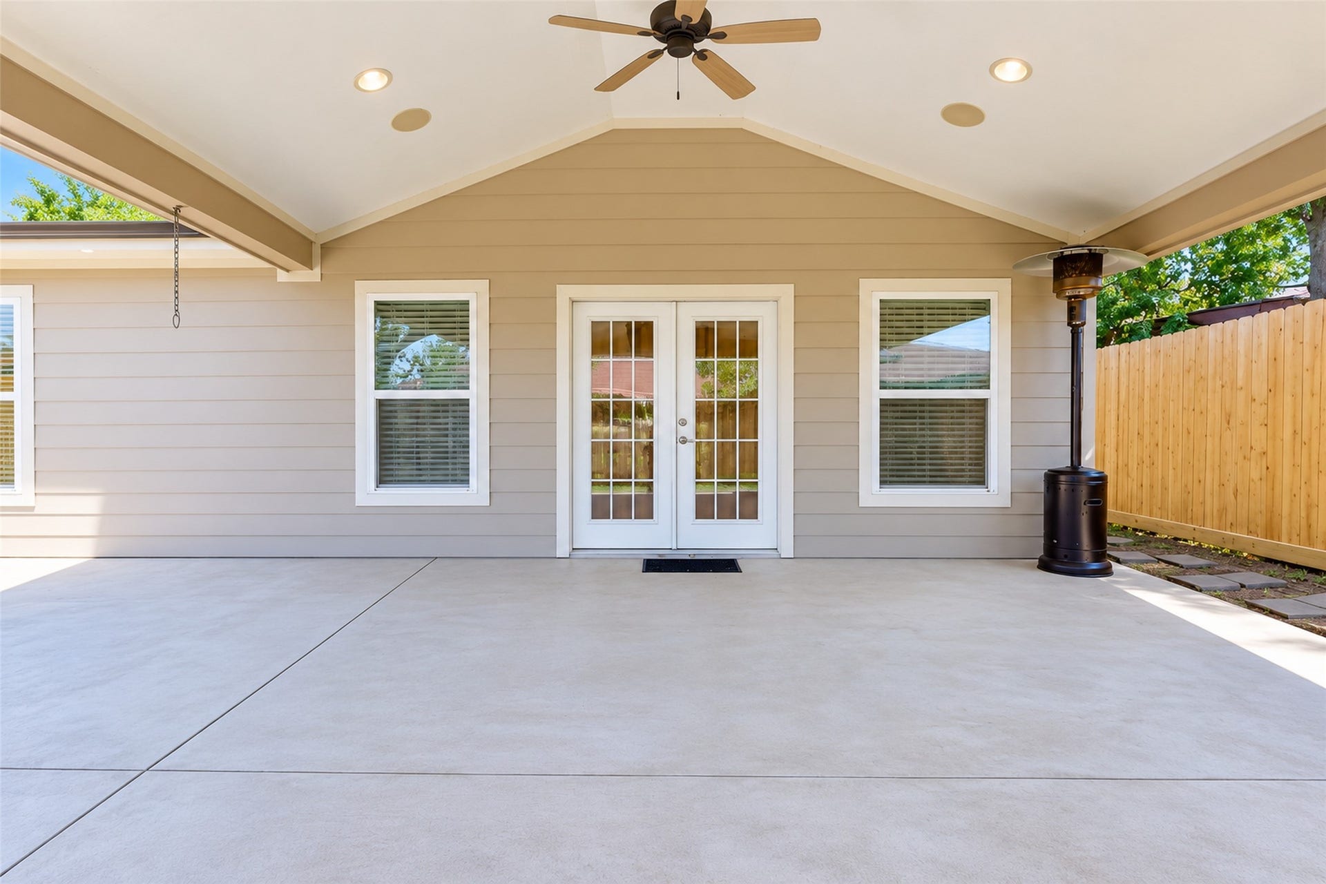 827 Dondell Street, Channelview, TX 77530 827 Dondell, Covered concrete outdoor patio with vaulted cielings recessed lighting, ceiling fan, and mounted TV. Fenced backyard for privacy.