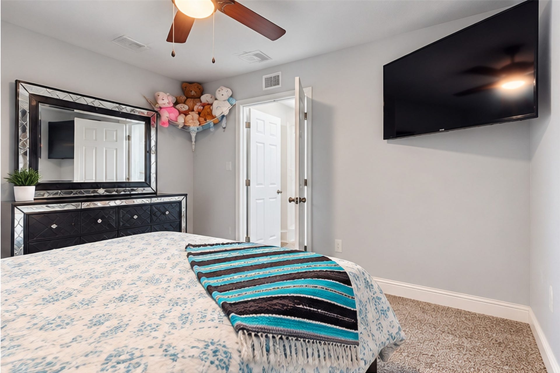 827 Dondell Street, Channelview, TX 77530 827 Dondell, 2nd Primary bedroom with it's own bathroom and walk-in closet, tan carpet and ceiling fan