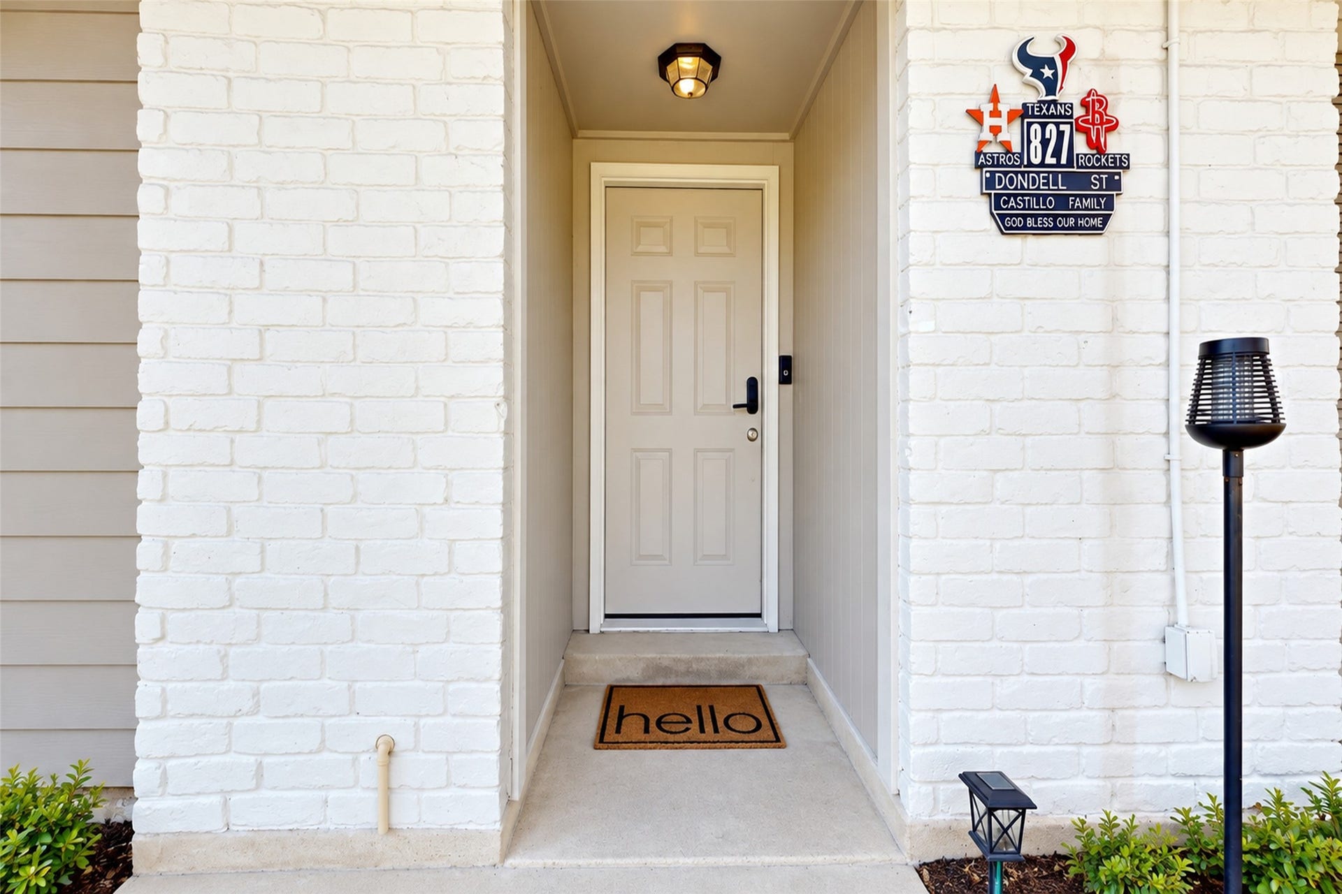 827 Dondell Street, Channelview, TX 77530 827 Dondell, White brick with white wooden door and a covered entry.