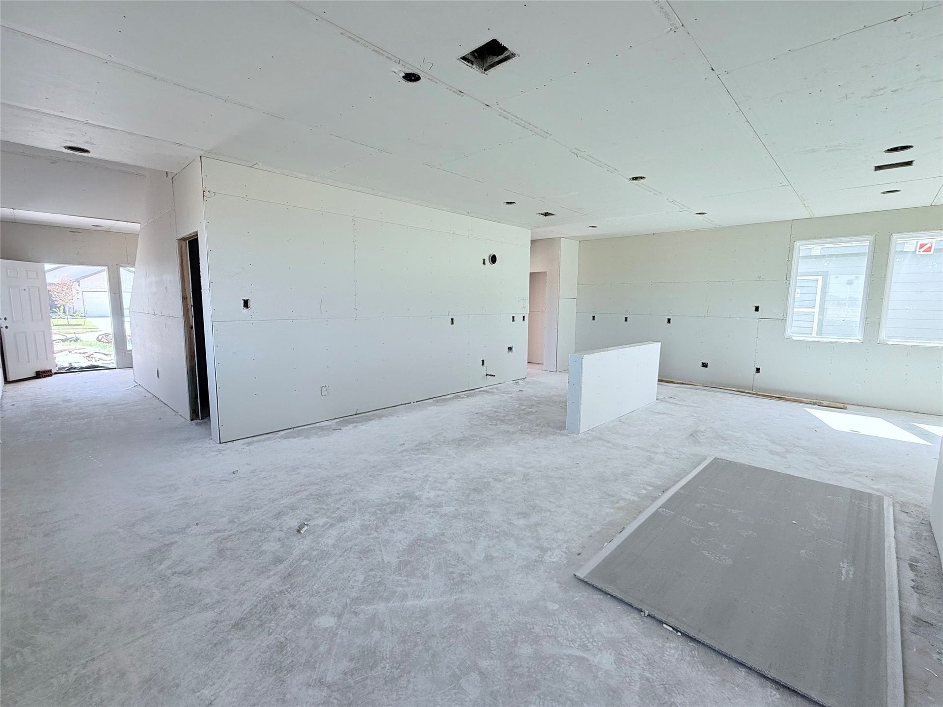 407 Hickory Hills Drive, Pattison, TX 77423 Living room into kitchen and foyer