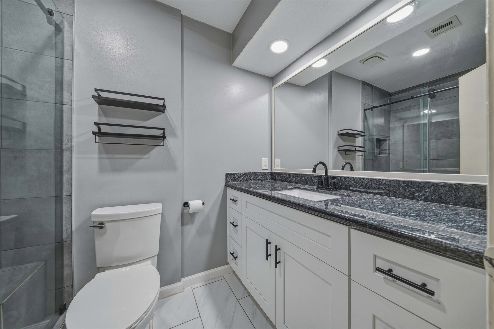 10514 Long River Drive, Sugar Land, TX 77498 Renovated guest bathroom featuring updated finishes and a fresh, modern feel