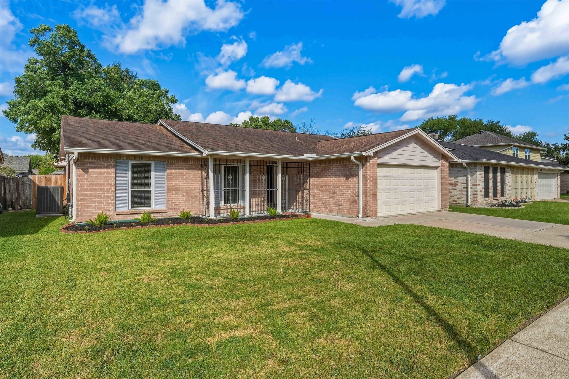 10514 Long River Drive, Sugar Land, TX 77498 Charming brick with a covered front porch