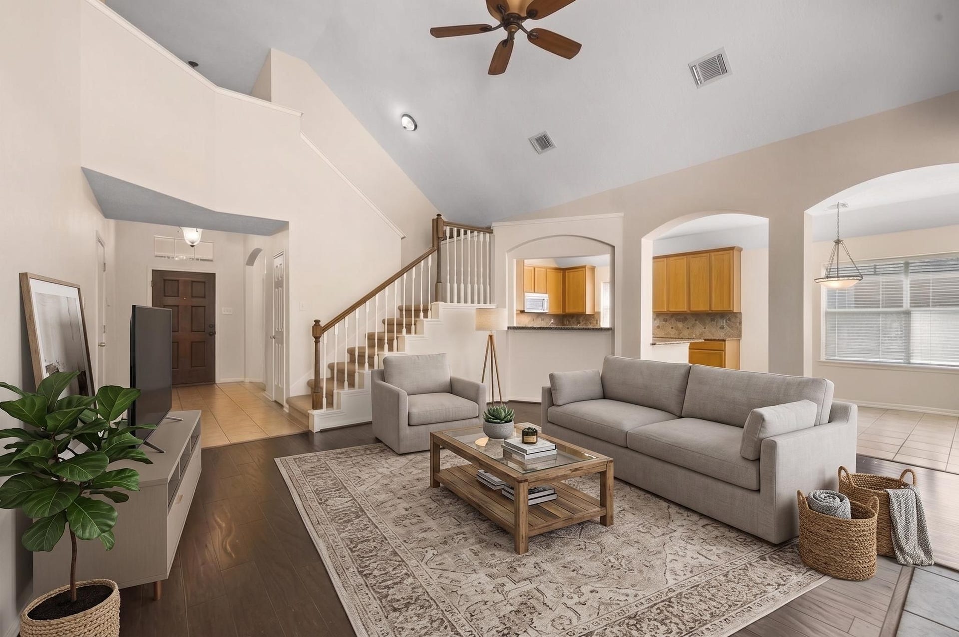 Soaring ceilings in the living room, and tons of windows for natural light (Virtually staged).