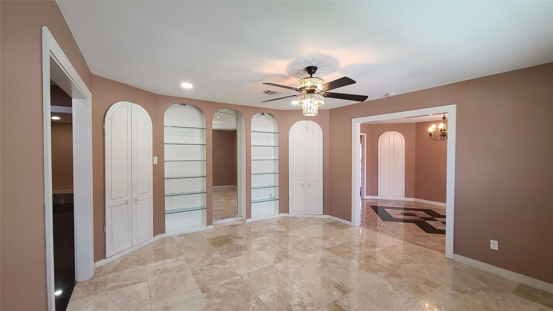 902 Ashford Parkway, Houston, TX 77077 Spacious driveway leads to a charming covered patio, perfect for entertaining, with seamless indoor flow where the living room is conveniently adjacent to the formal dining area.
