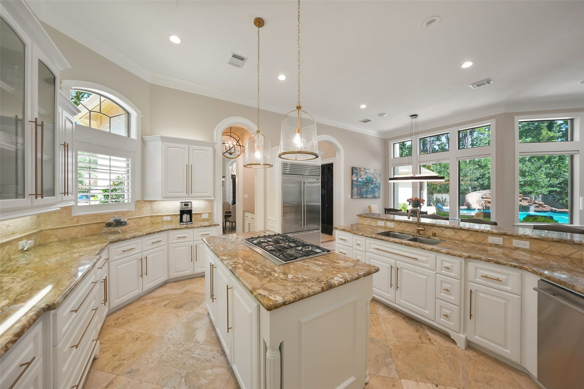 19 Harmony Links Place, The Woodlands, TX 77382 The six burner cooktop island allows the chef to be the center of the action. New Thermador cooktop, retractable vent, double ovens, microwave, and dishwasher were installed in 2023! Built in stainless steel SubZero Refrigerator!