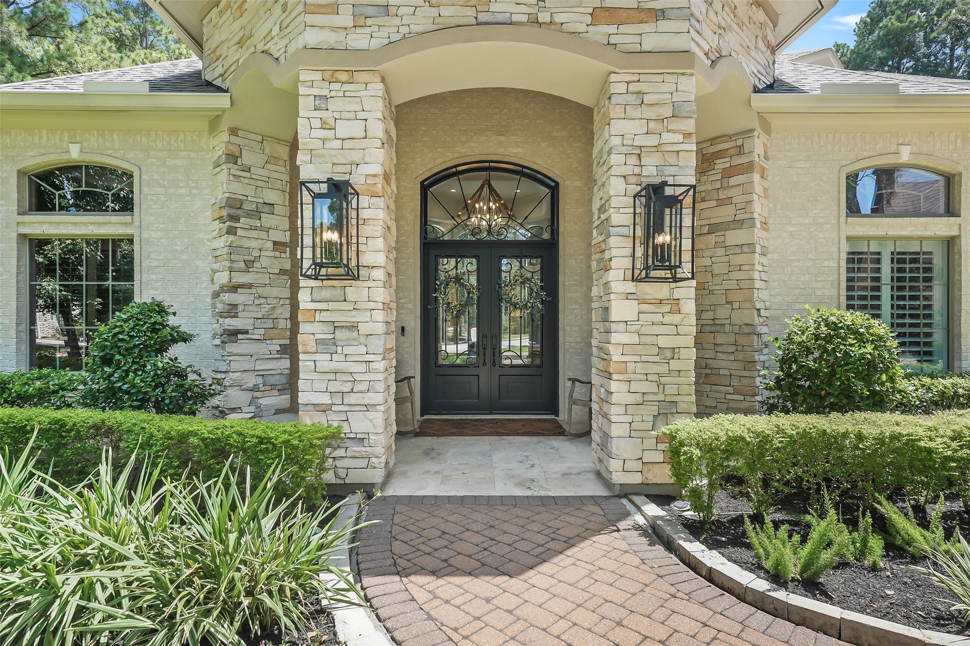 19 Harmony Links Place, The Woodlands, TX 77382 The covered front porch protects guests from the elements. This Marshall built home features five spacious en-suite bedrooms and a three-car garage!