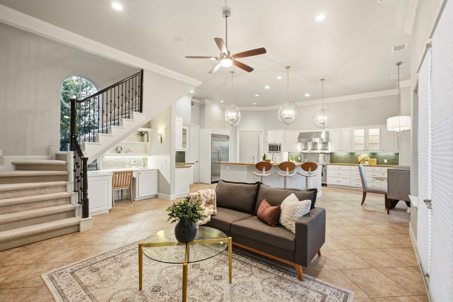 3518 River Forest Drive, Richmond, TX 77406 Experience seamless flow and functionality with a charming second staircase conveniently located in the heart of the kitchen, enhancing this open and inviting living space.