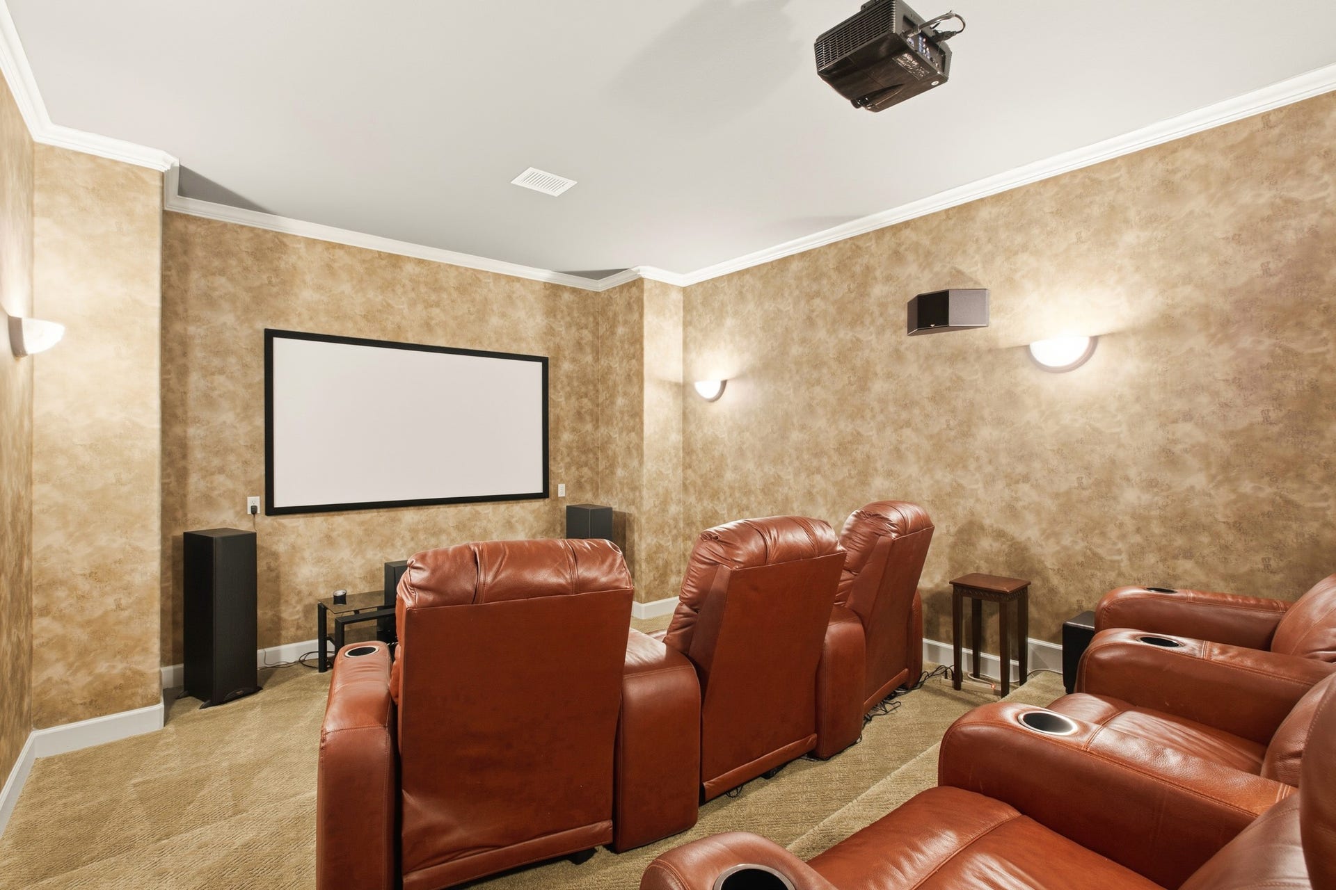 3518 River Forest Drive, Richmond, TX 77406 Immerse yourself in cinematic luxury with this stunning media room, featuring plush leather seating, state-of-the-art audio-visual equipment, and an inviting ambiance perfect for movie nights.