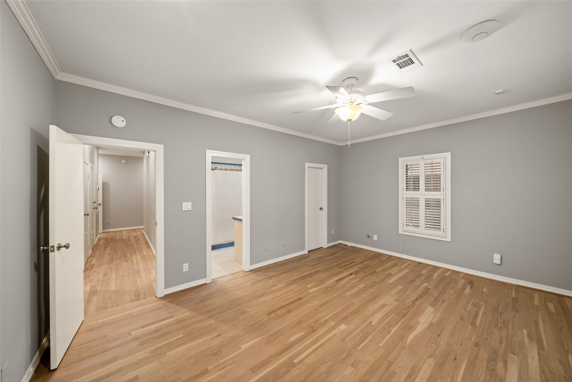 View of the front secondary bedroom looking toward the hallway and bath.