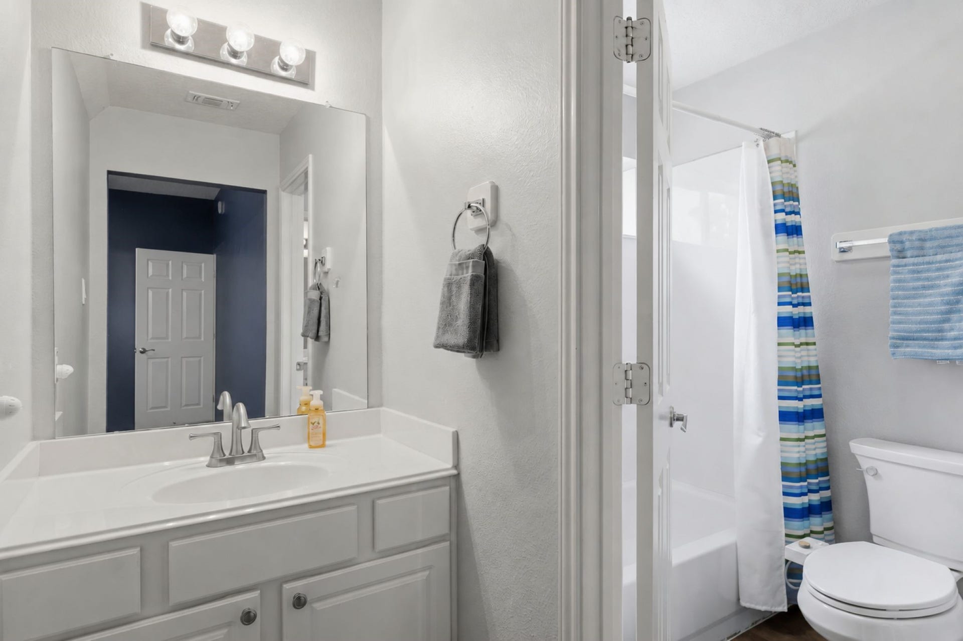 Two of the secondary bedrooms share this Jack and Jill bathroom upstairs.
