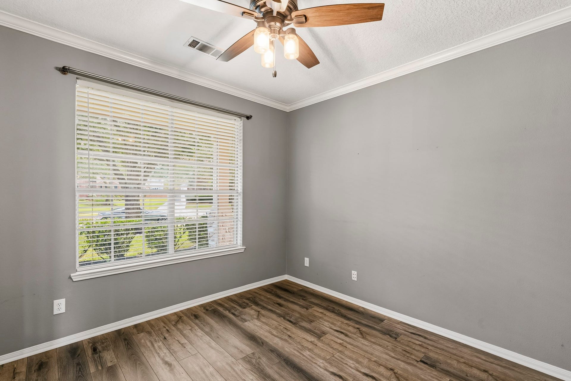 Dedicated home office with abundant natural light and glass french doors.