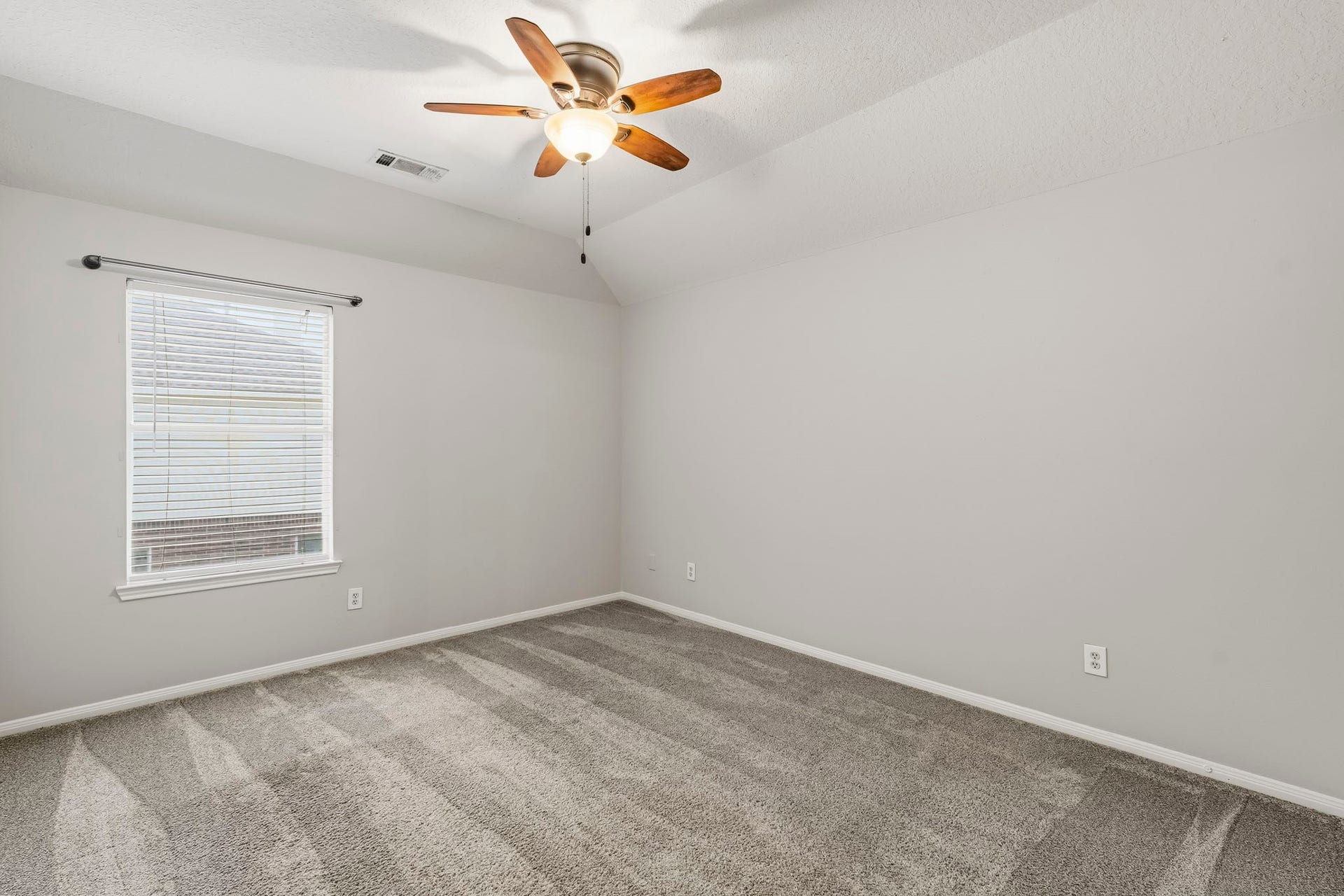 Another secondary bedroom upstairs that shares the ensuite bathroom.