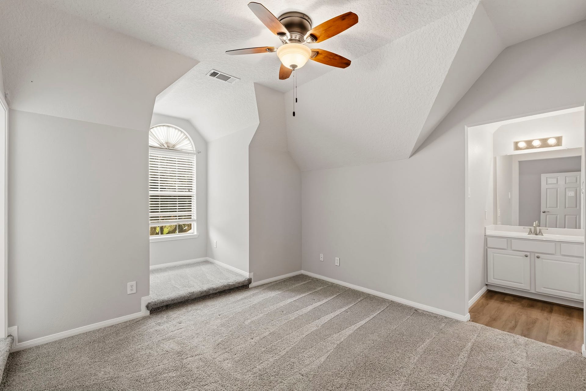 Upstairs, you'll find this secondary bedroom featuring a charming built in niche, perfect for a homework station, or creative workspace.