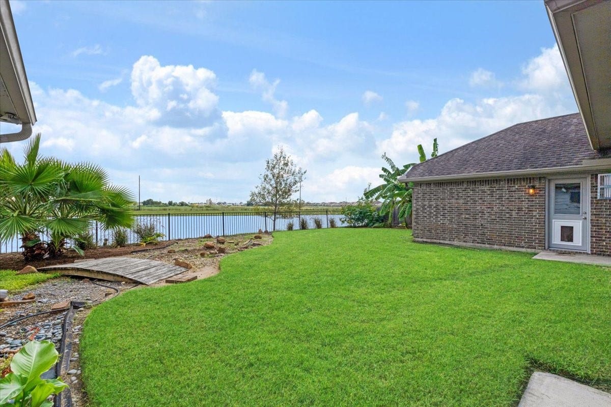 Make lake views part of your everyday routine. This Lakeland backyard offers room to relax, garden or gather outdoors, with tropical landscaping and an open water view creating a memorable finish to the tour.
