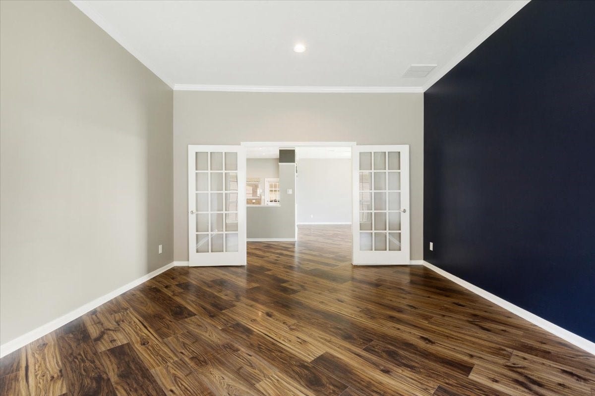 Give dinner its own place. This separate dining room offers a welcoming setting for shared meals and special occasions, with wood floors and French doors connecting it to the homes main gathering spaces.