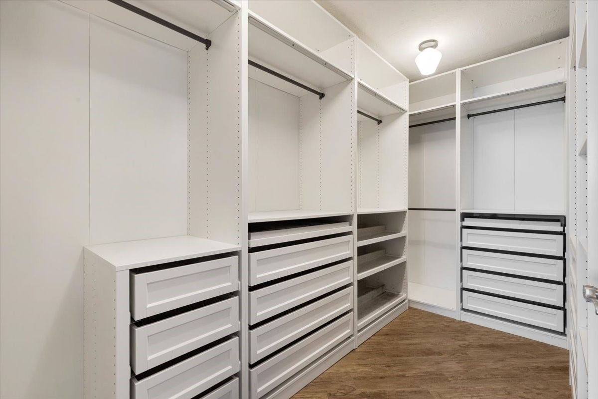 Start the day with everything in its place. The primary walk-in closets extensive built-in drawers, shelving and hanging space help keep your wardrobe organized and your bedroom focused on rest.