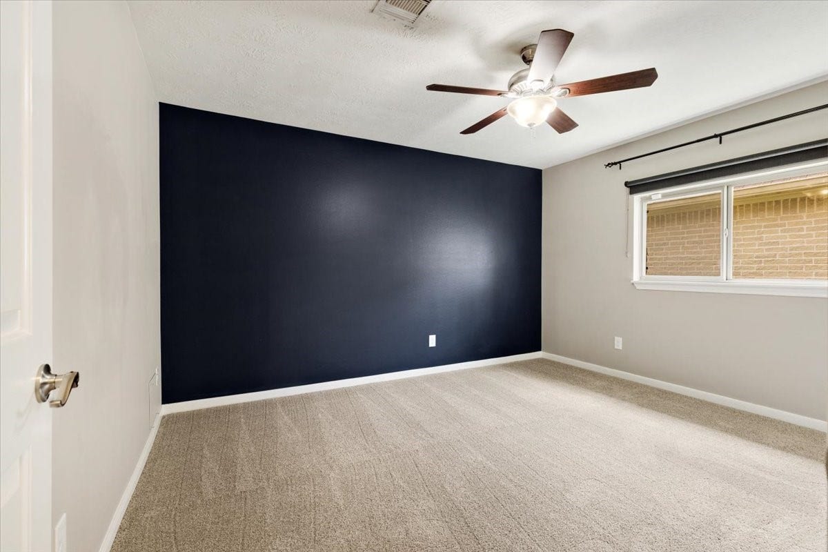 Fresh new carpet makes this additional bedroom ready to make your own. Having another dedicated room gives everyone more breathing room and keeps the main living spaces available for gathering.