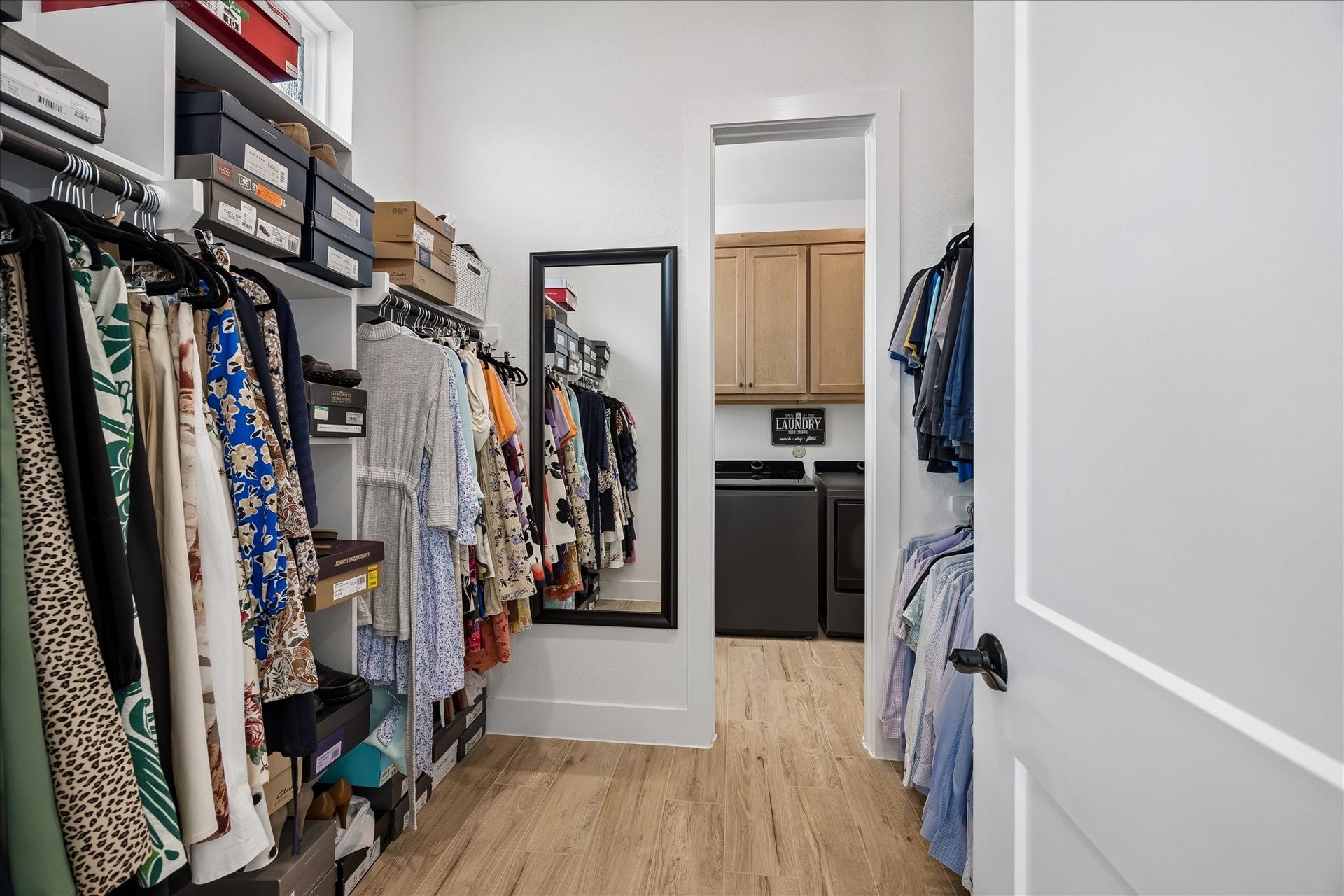 32438 Violet Dancer Court, Fulshear, TX 77441 Convenient, direct access from the one of the primary closets to the spacious laundry room.