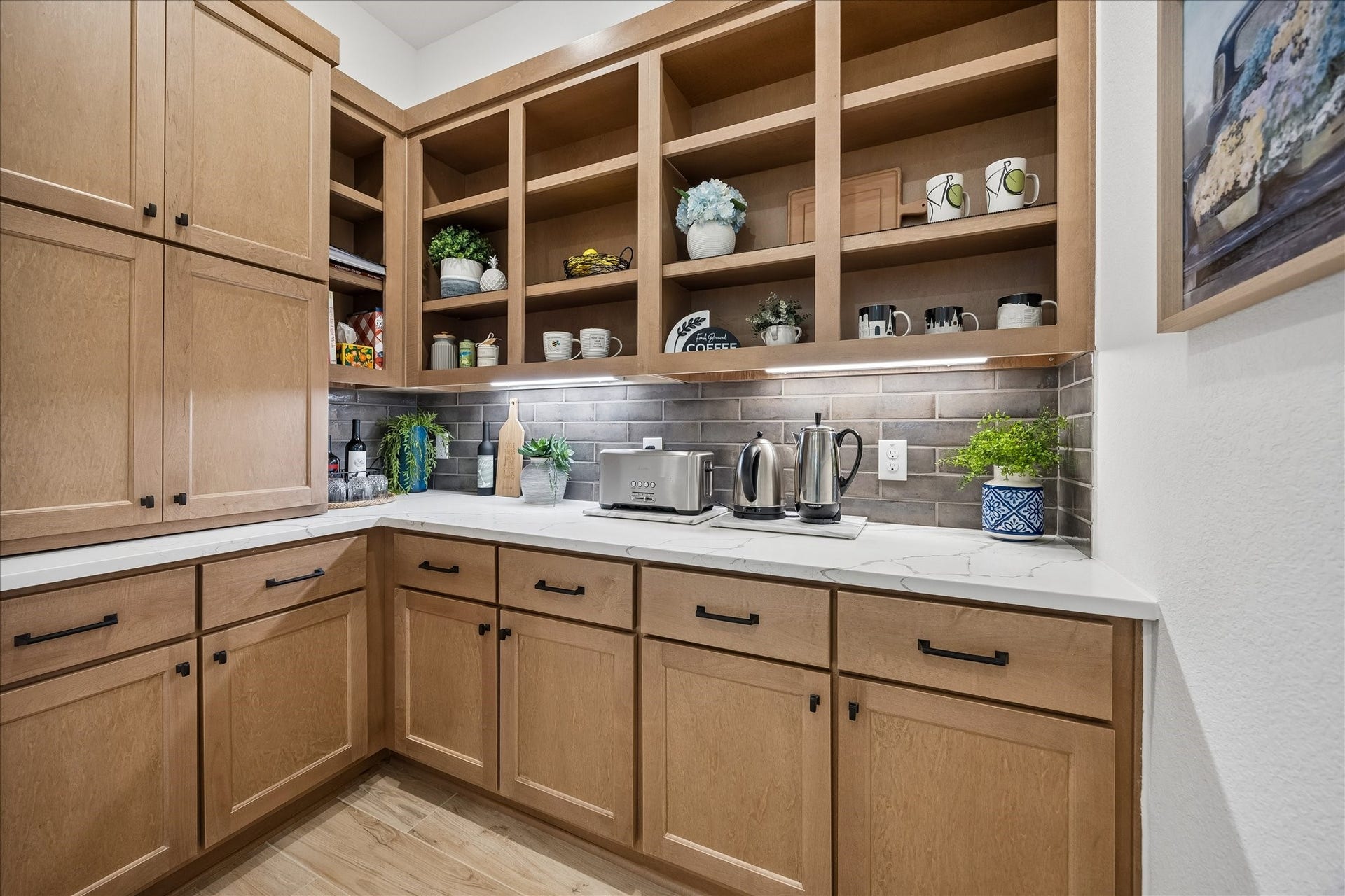32438 Violet Dancer Court, Fulshear, TX 77441 This upgraded extended pantry/coffee bar, located just off the kitchen, features elegant granite countertops, a designer earth-tone subway tile backsplash, and custom soft close cabinetry; plenty of extra storage.