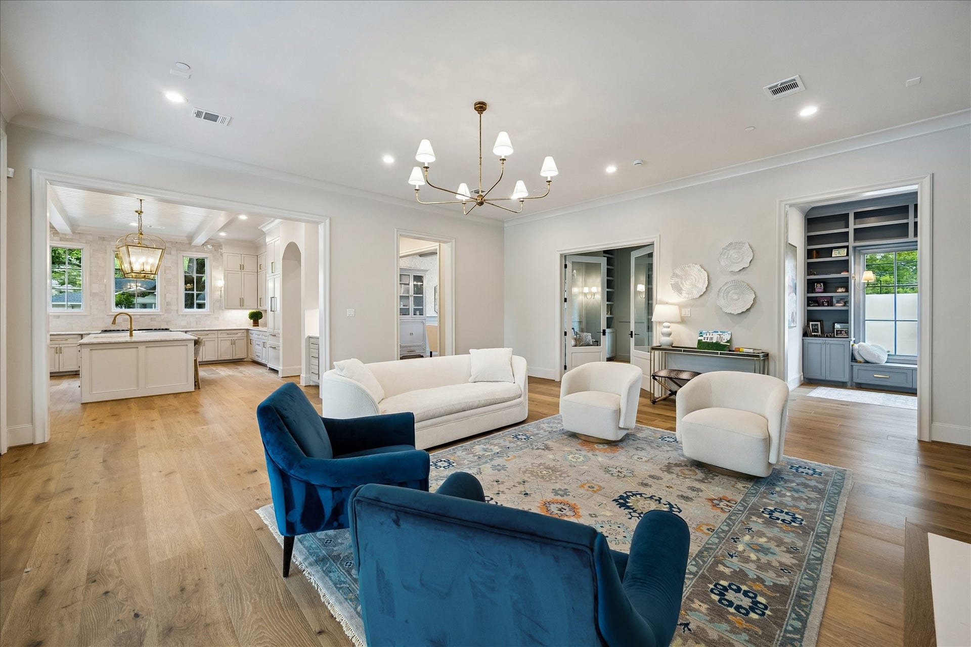 10801 Long Shadow Lane, Hunters Creek Village, TX 77024 Looking back toward the kitchen, the expansive living area highlights its seamless connection to the heart of the home. Wide openings enhance the airy feel, while the elevated finishes and architectural detailing continue throughout, creating a cohesive and inviting living environment.