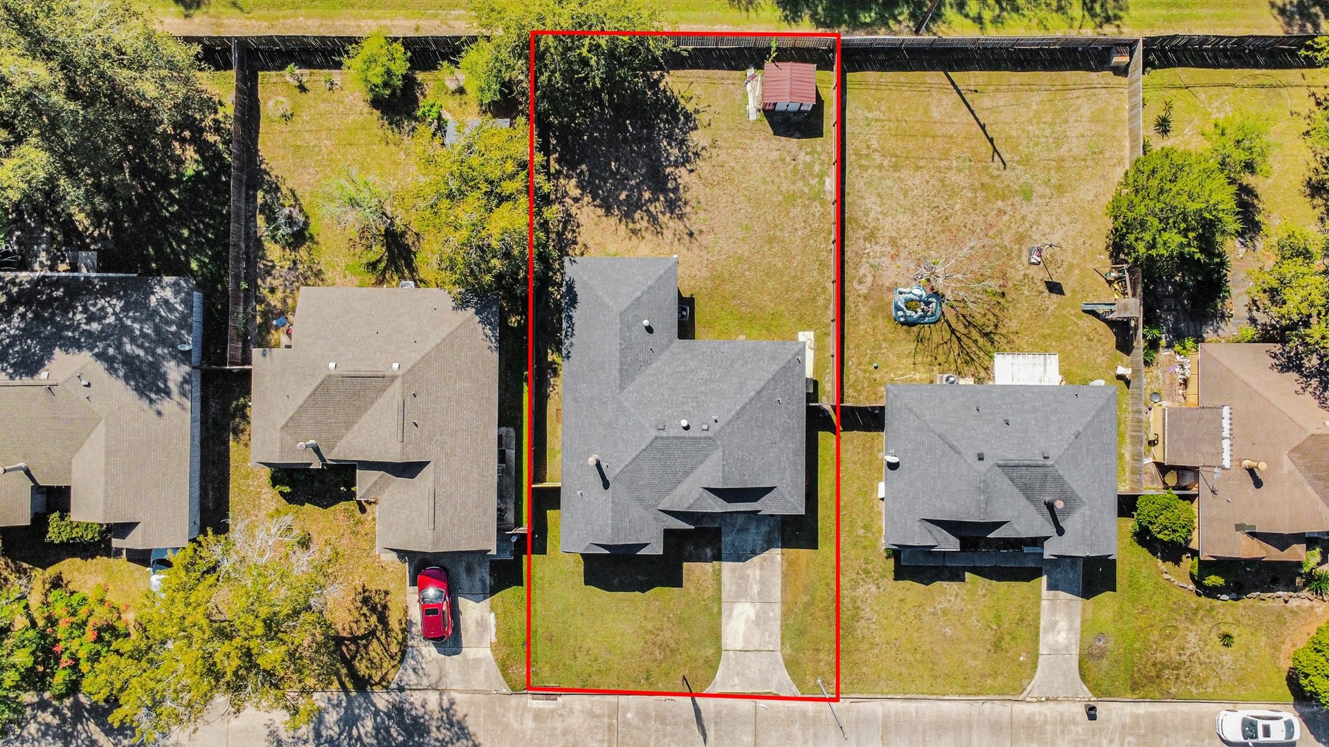 Aerial view showcasing the spacious lot with a generously sized backyard and plenty of room to enjoy! Whether you envision adding a covered patio, creating an outdoor entertainment area, or simply enjoying the open green space, this property offers endless possibilities to make it your own!