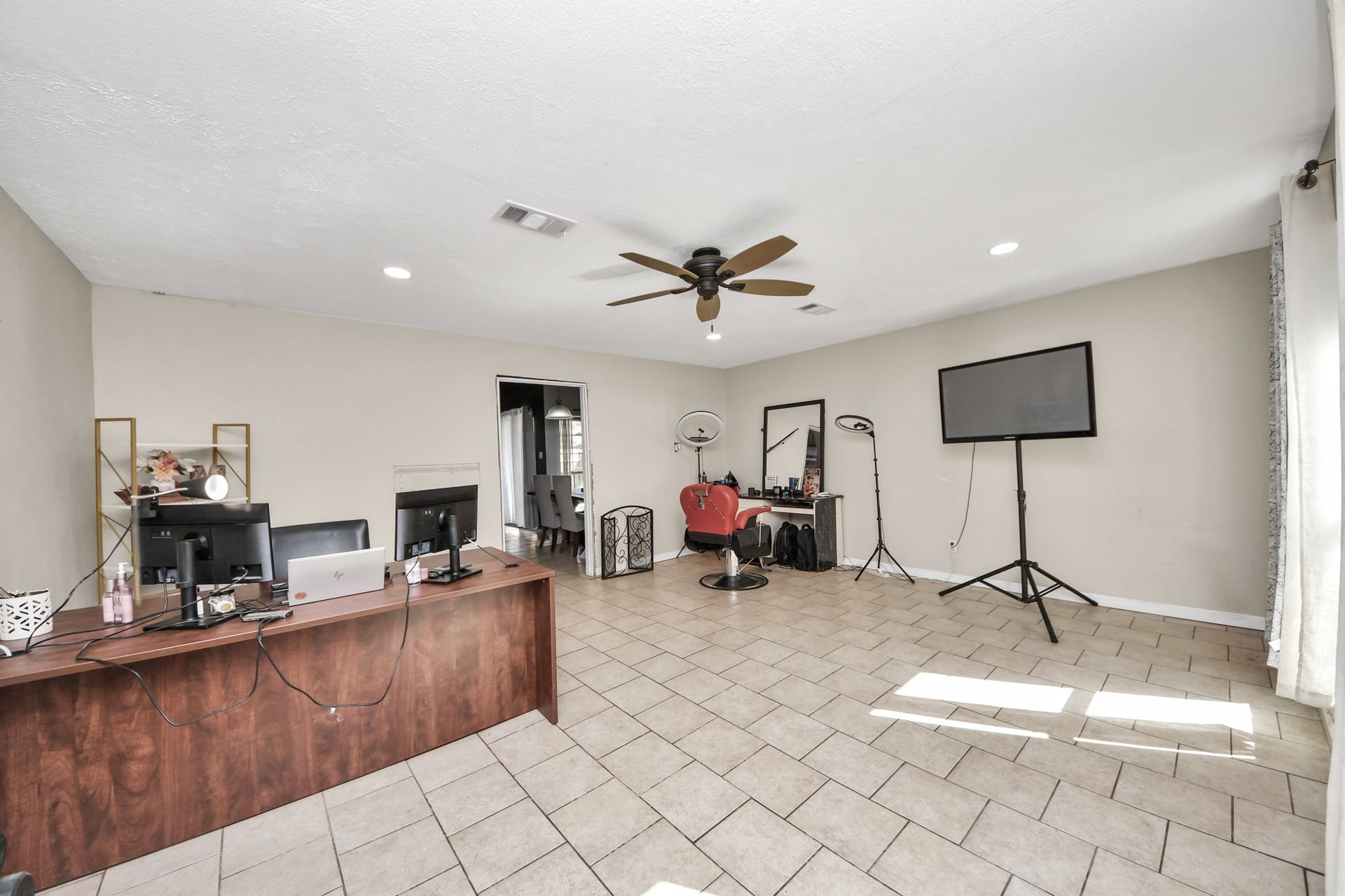 Expansive bonus room offering endless possibilities! Currently used as a home office and flex space, this versatile area features tile flooring, recessed lighting, a ceiling fan, and plenty of natural light. Easily transform it into a second living area, game room, media room, or entertainment space to fit your lifestyle!