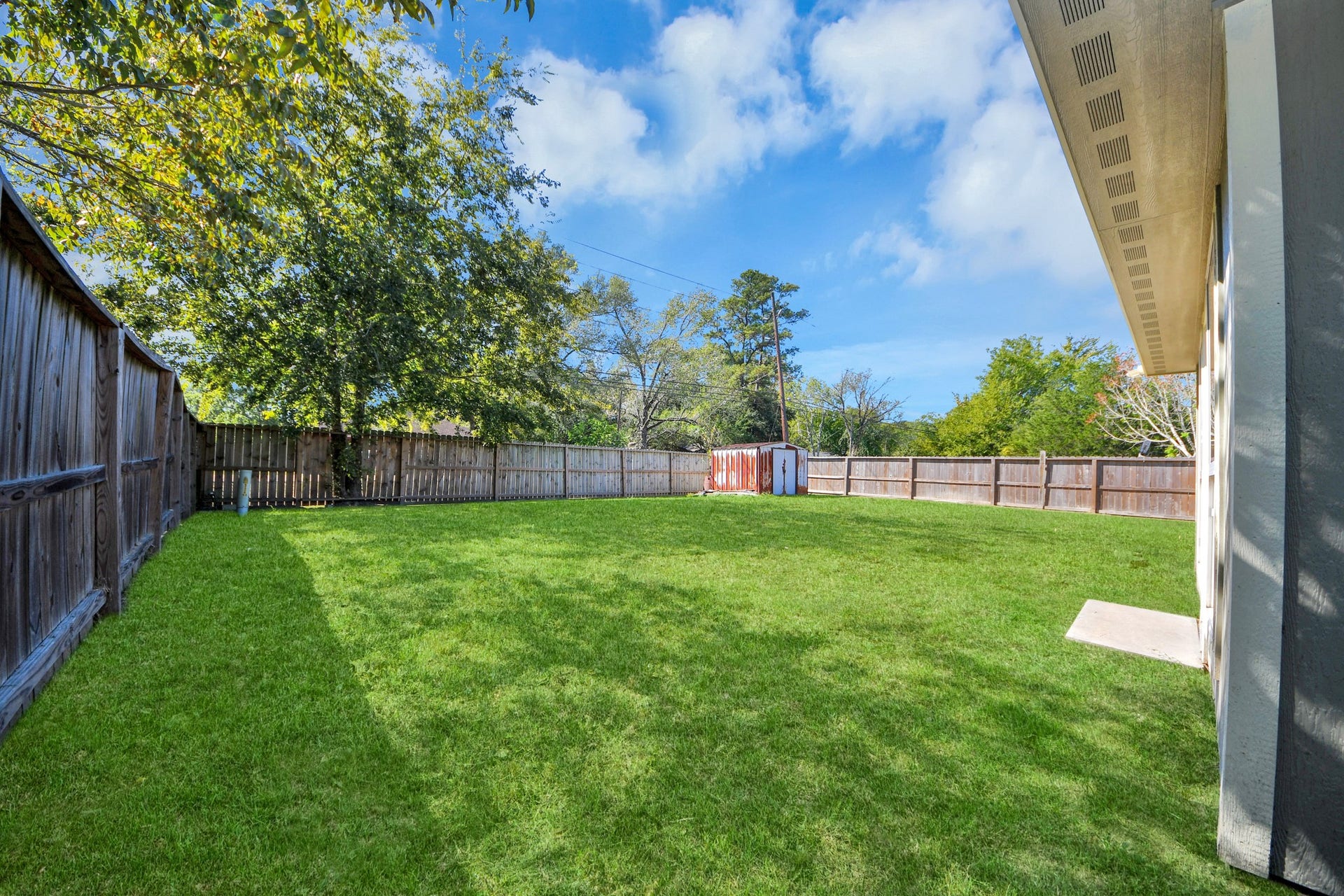 Spacious backyard with endless possibilities! Plenty of room for outdoor activities, family gatherings, or entertaining. Create your dream outdoor retreat by adding a covered patio, outdoor kitchen, or expanding the existing outdoor living space.