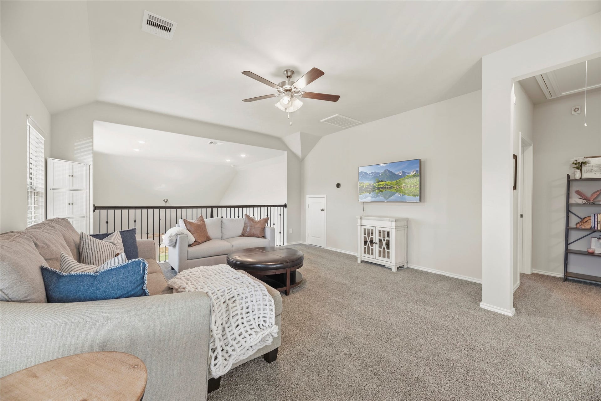 The spacious game room on the second floor, near two additional bedrooms upstairs.
