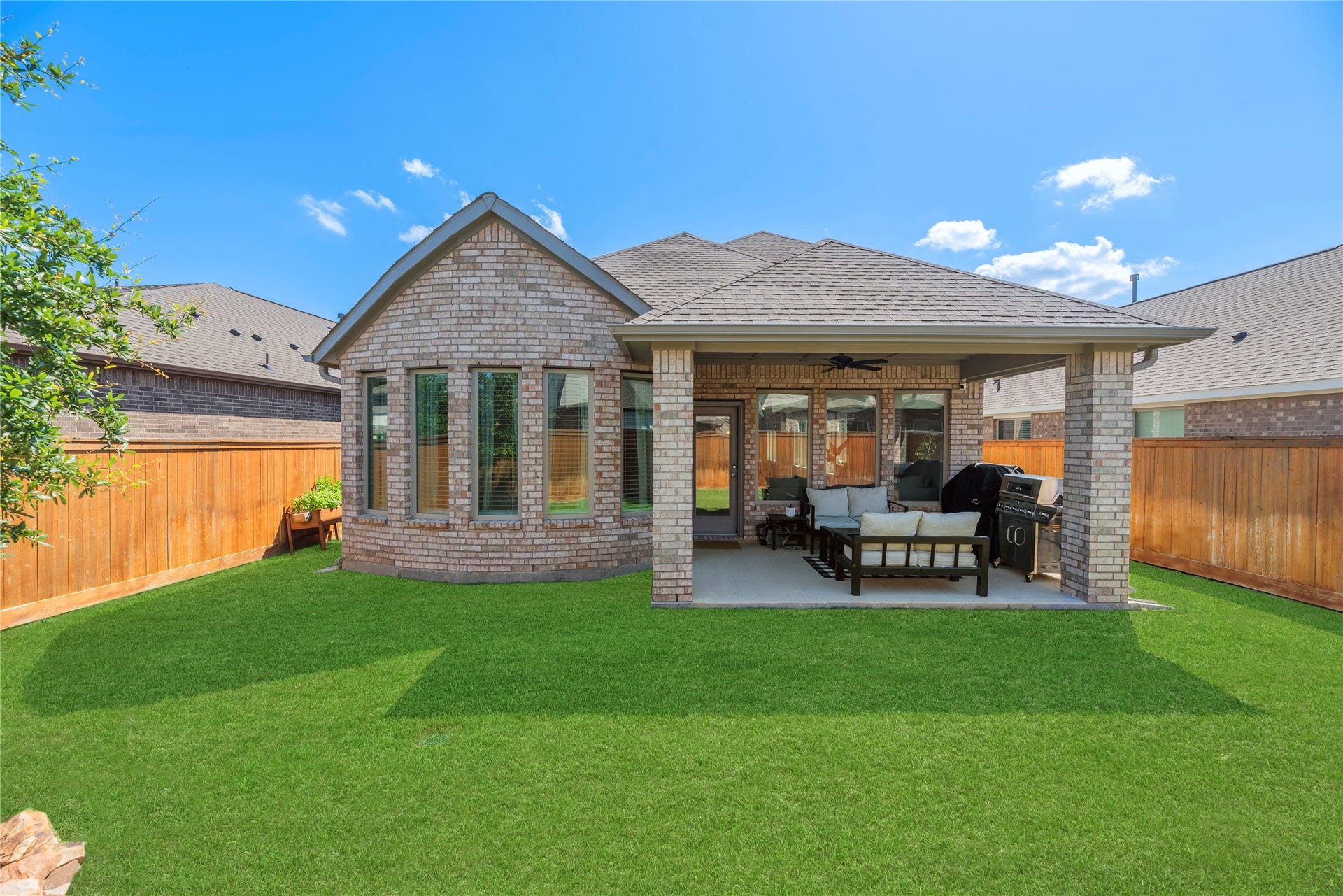 Spacious backyard with covered patio area