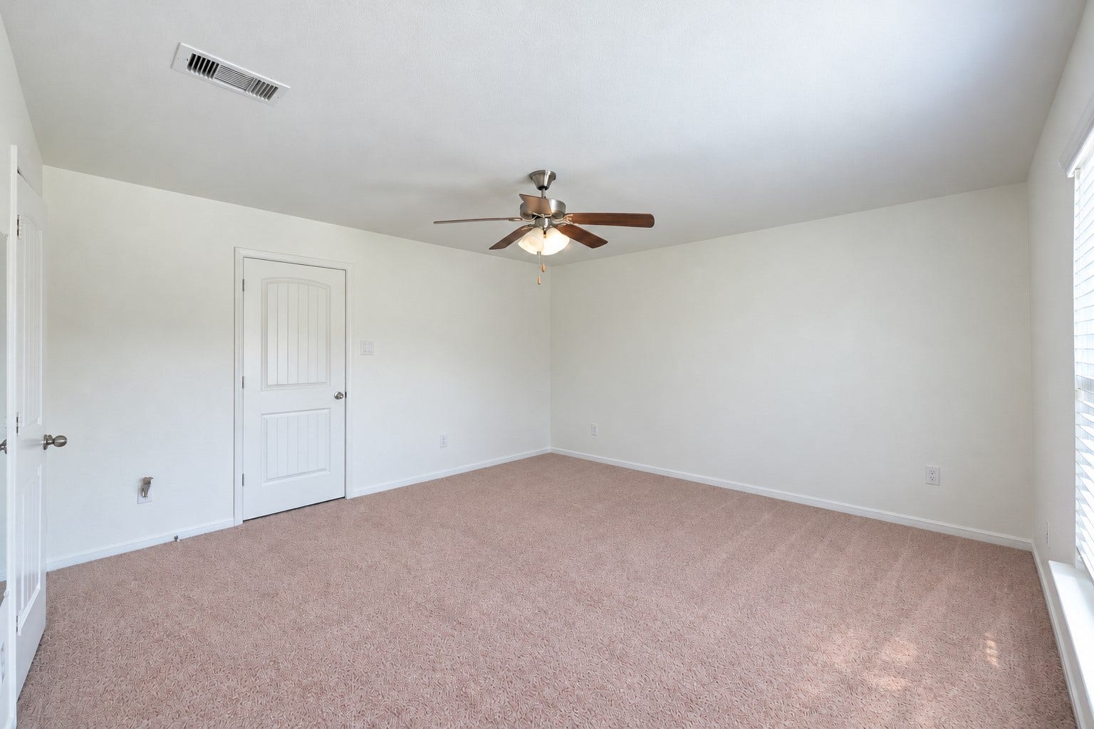 134 Meadow Landing Drive, Conroe, TX 77384 This photo has been digitally (un)staged (all furniture and decor removed) to show the potential of this additional room downstairs. | Curious how your furniture would look? Download this picture and take pictures of your current furniture and upload both into ChatGPT and ask it to stage the room using your furniture--it won't look exact but it can give you a great idea!