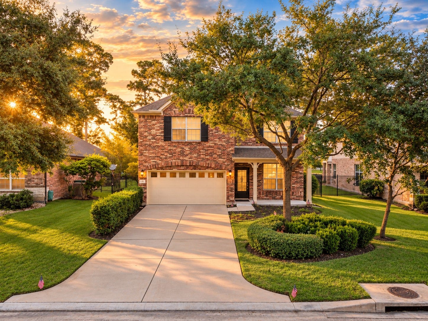 78 Heritage Mill, The Woodlands, TX 77375 A beautiful brick exterior welcomes you home, surrounded by mature trees and lush landscaping. The inviting front entry, spacious driveway, and warm sunset glow create exceptional curb appeal.