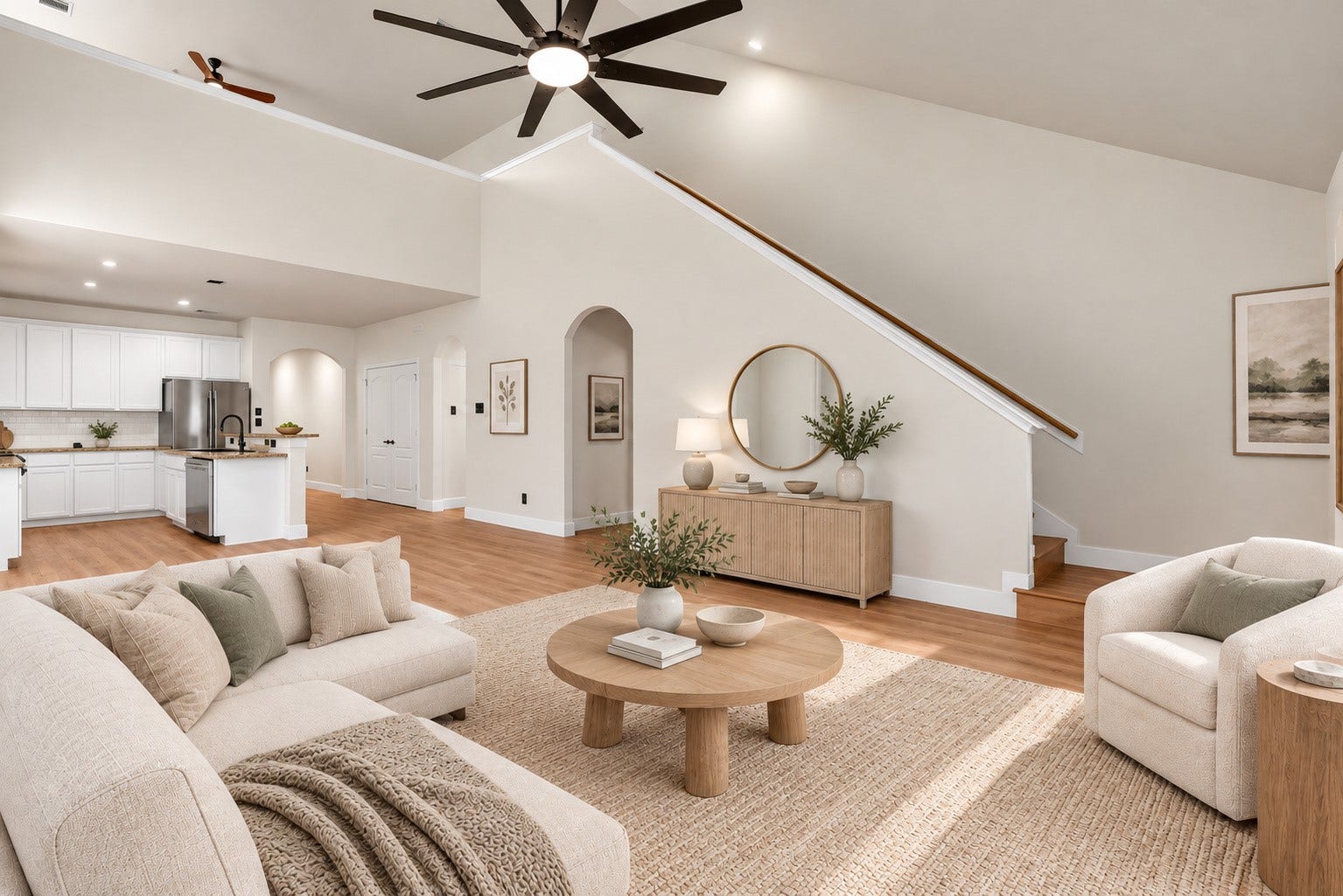 78 Heritage Mill, The Woodlands, TX 77375 Impressive soaring ceilings open to the second story create a grand, airy atmosphere, filling the spacious living area with natural light and enhancing the home's open-concept design.