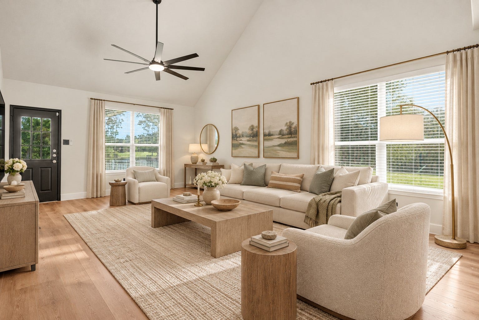 78 Heritage Mill, The Woodlands, TX 77375 Beautiful, light-filled living room featuring soaring ceilings, expansive windows, and an open layout with serene views of the backyard and surrounding greenery.