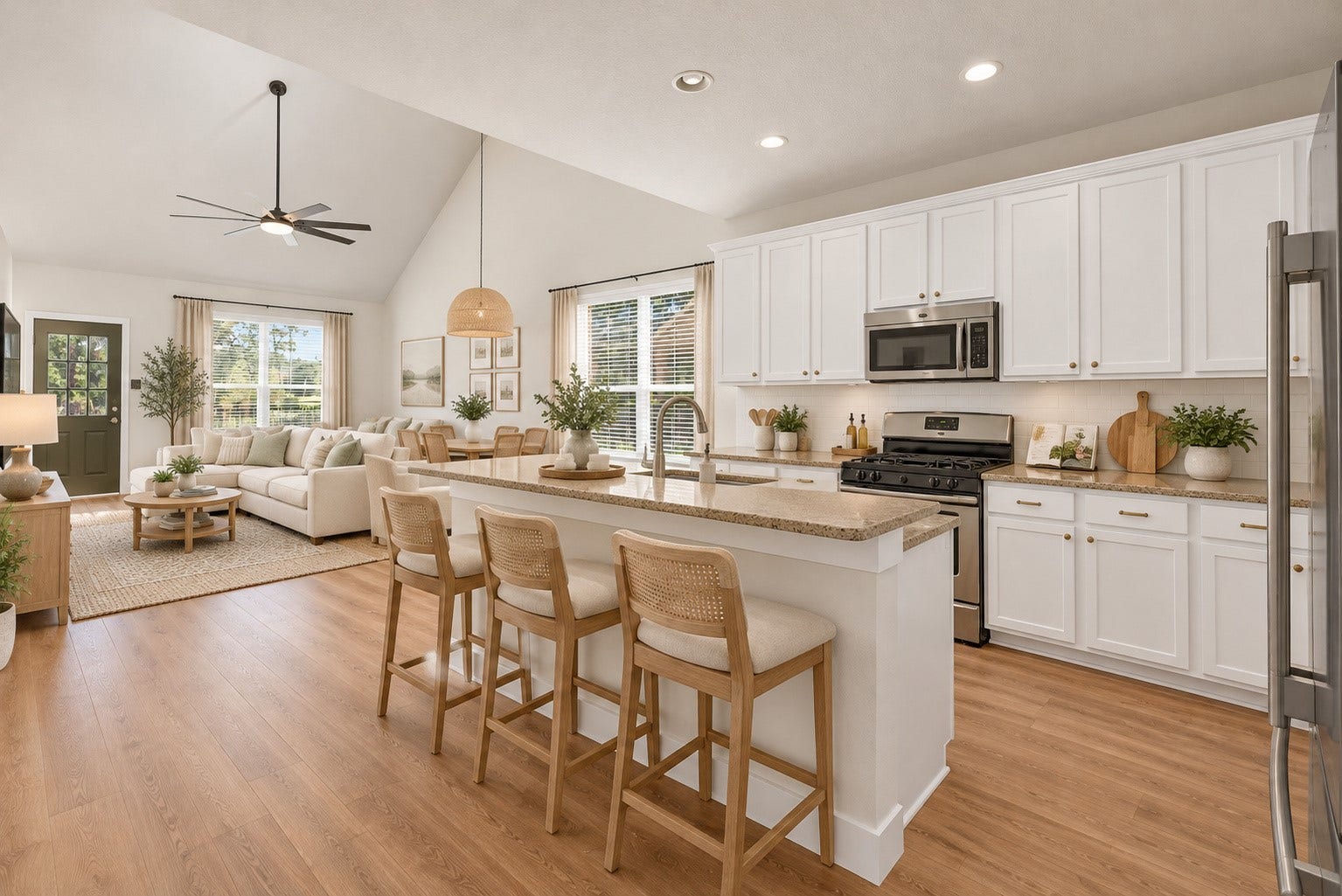 78 Heritage Mill, The Woodlands, TX 77375 Beautifully updated, light-filled kitchen featuring crisp white cabinetry, stainless steel appliances, generous counter space, and a spacious breakfast bar. The open-concept design flows seamlessly into the dining and living areas, creating an inviting space for everyday living and entertaining.