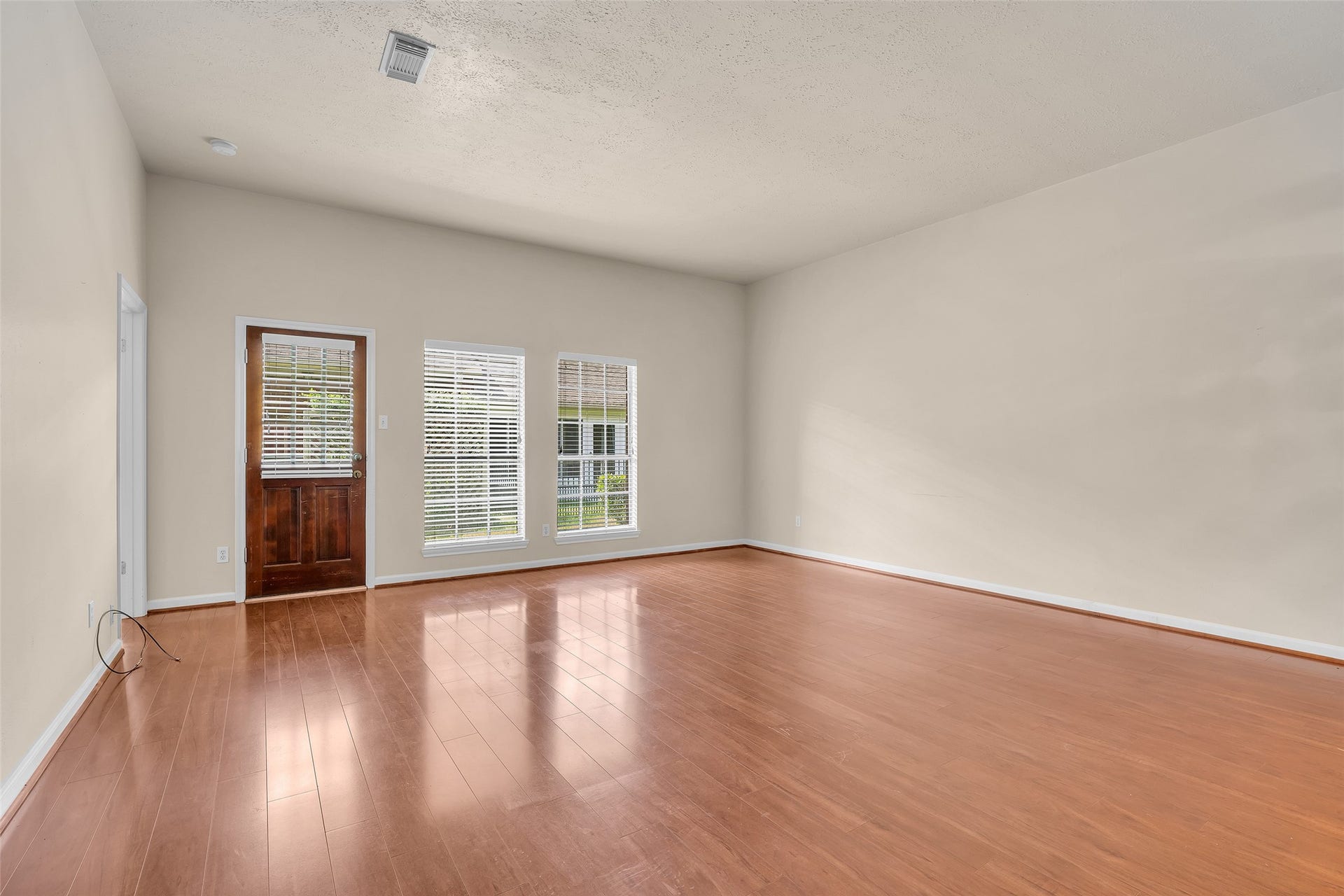 3310 Country Meadows Court, Pearland, TX 77584 A backdoor provides convenient access from the living room directly to the backyard.