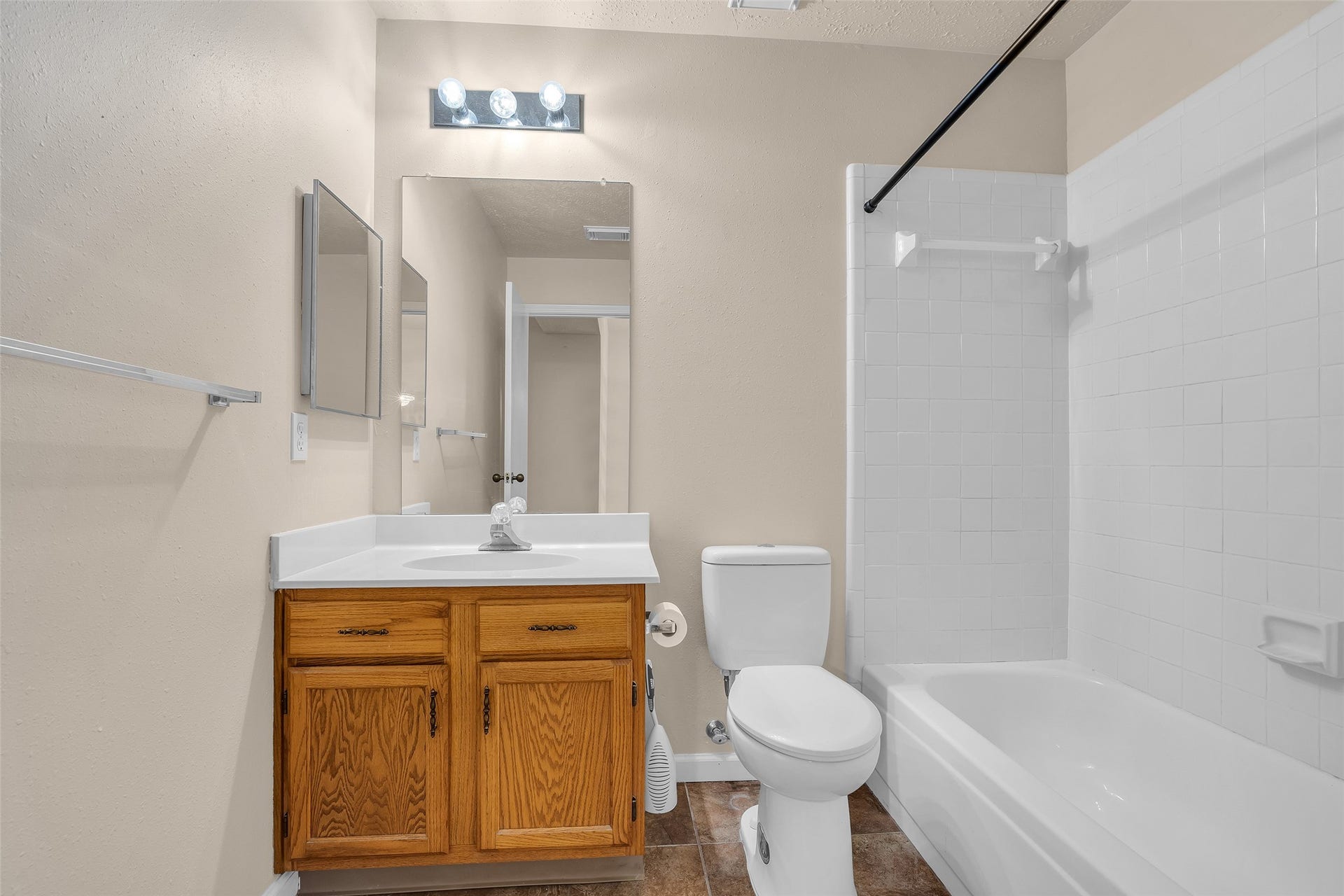 3310 Country Meadows Court, Pearland, TX 77584 Secondary bathroom featuring a tub and shower combination with modern fixtures, designed for practical everyday use and easy maintenance.