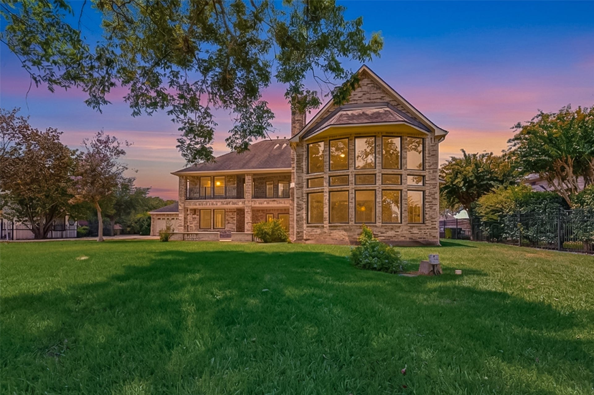 Stunning view of the back of the home from the water.