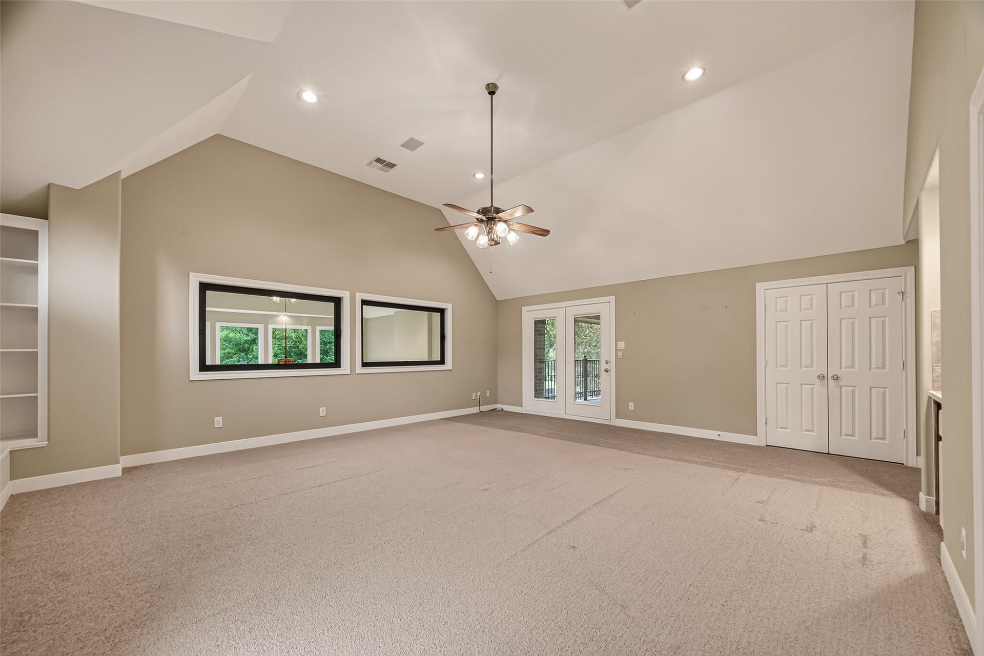 The Game Room with French Doors that lead to the balcony.
