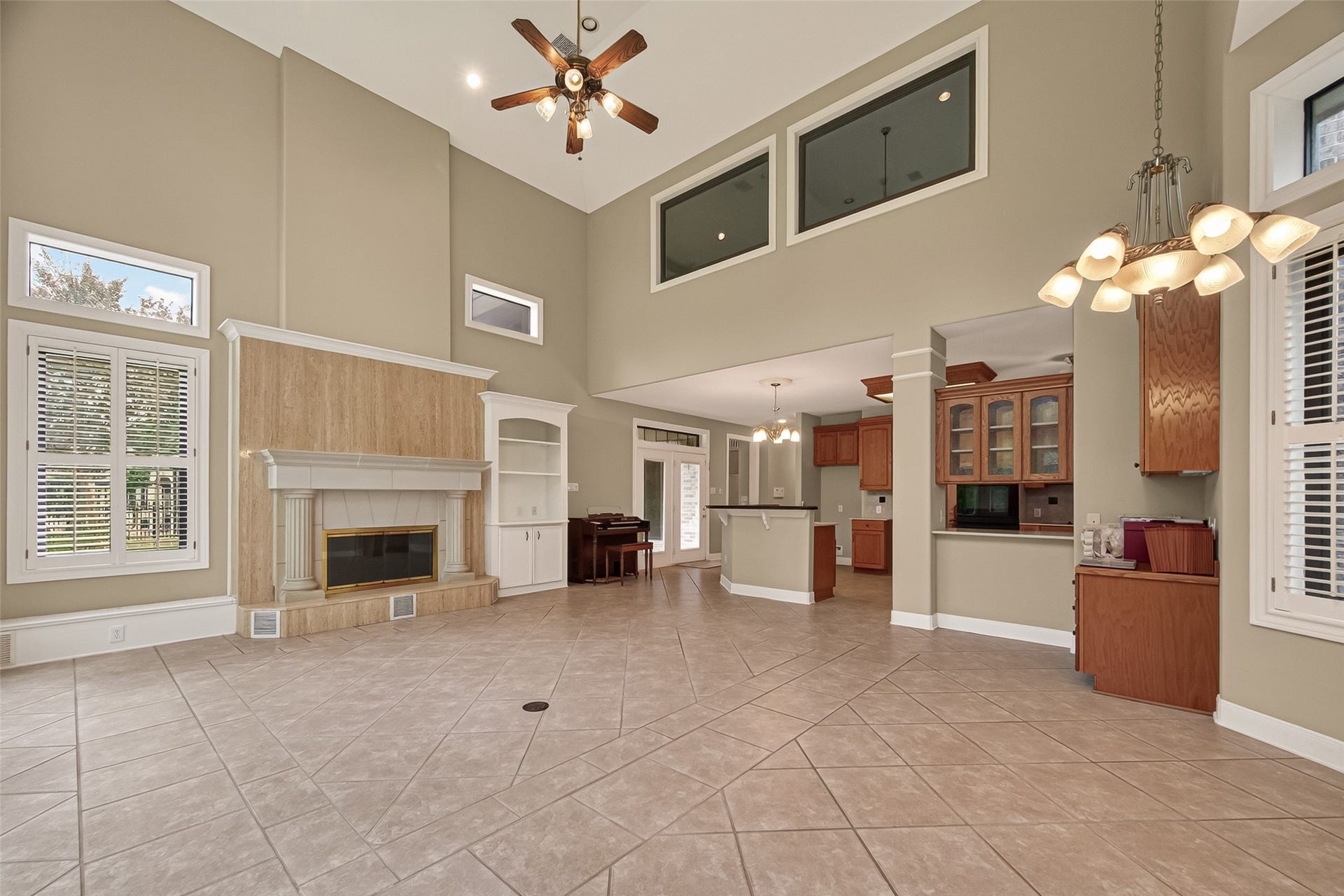 A lovely fireplace in this room too.  The top windows are to the Game Room and open too.