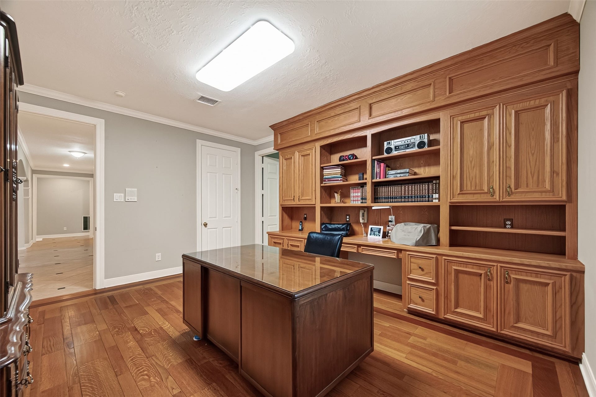 One of two large Studies with wood cabinetry built in. Quality millwork throughtout.