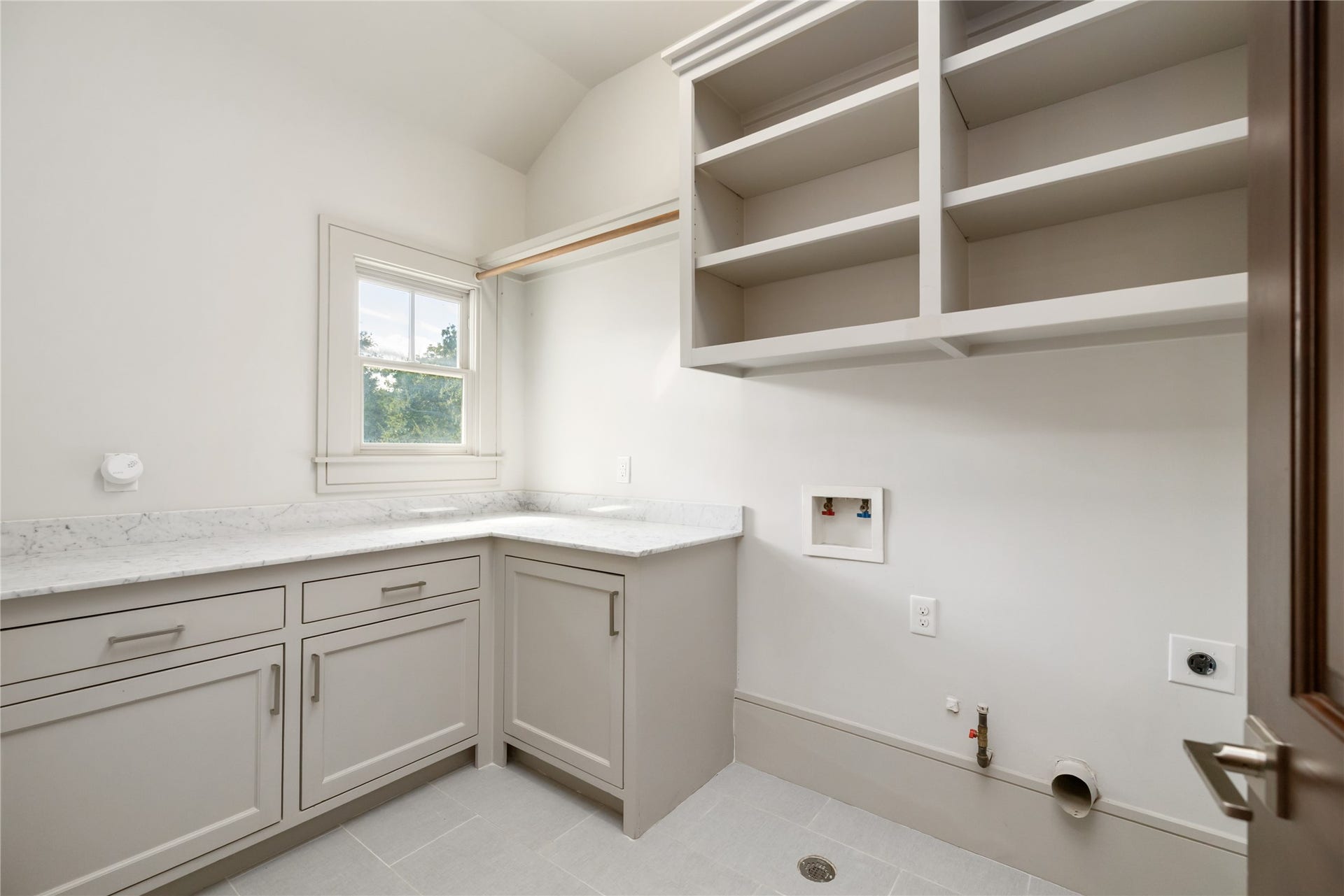The large laundry room services the upstairs bedrooms
