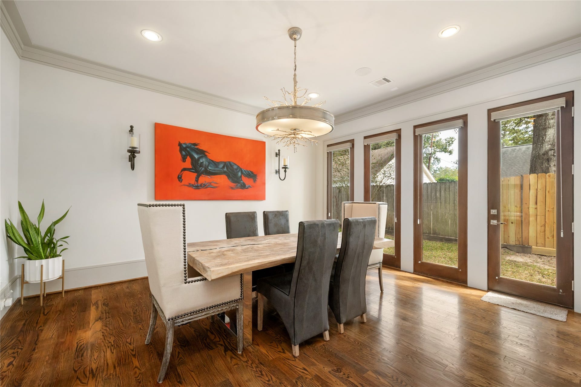 Beautiful dining room is open to the living and has a door to the side yard