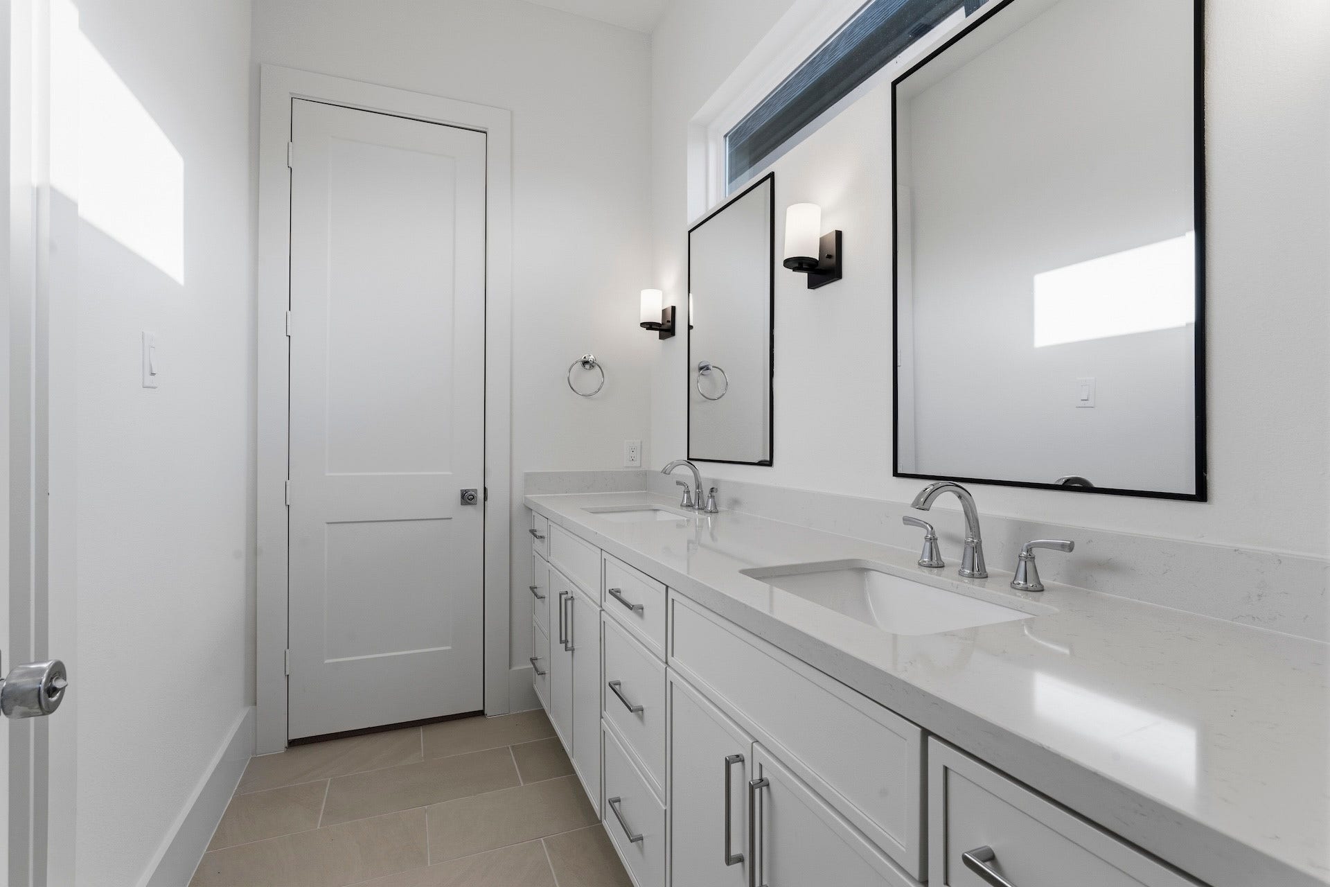 Well Organized - The Guest Bath features a double vanity with quartz countertop, under-mount
sinks framed mirror flanked by a pair of wall sconces. Private toilet and bath.