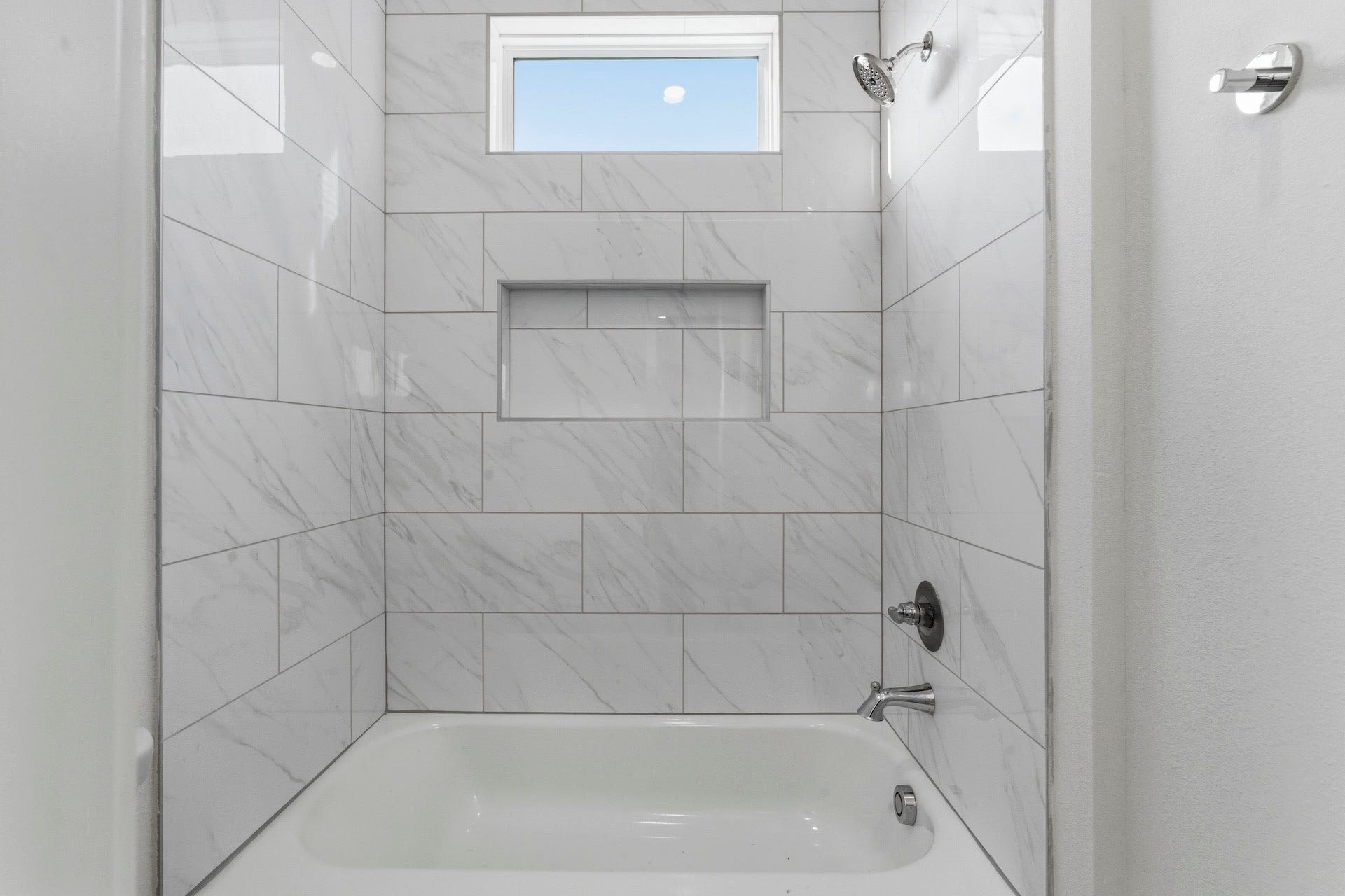 Well Organized - The Guest Bath features a double vanity with quartz countertop, under-mount
sinks framed mirror flanked by a pair of wall sconces. Private toilet and bath.