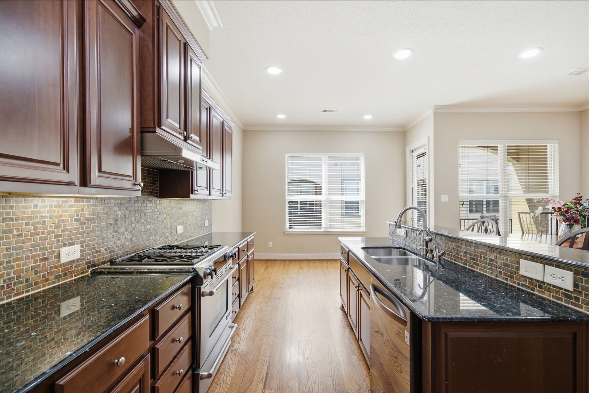 15 Laurelwood Drive, Houston, TX 77058 Natural light and stylish surroundings complement the functional kitchen design...