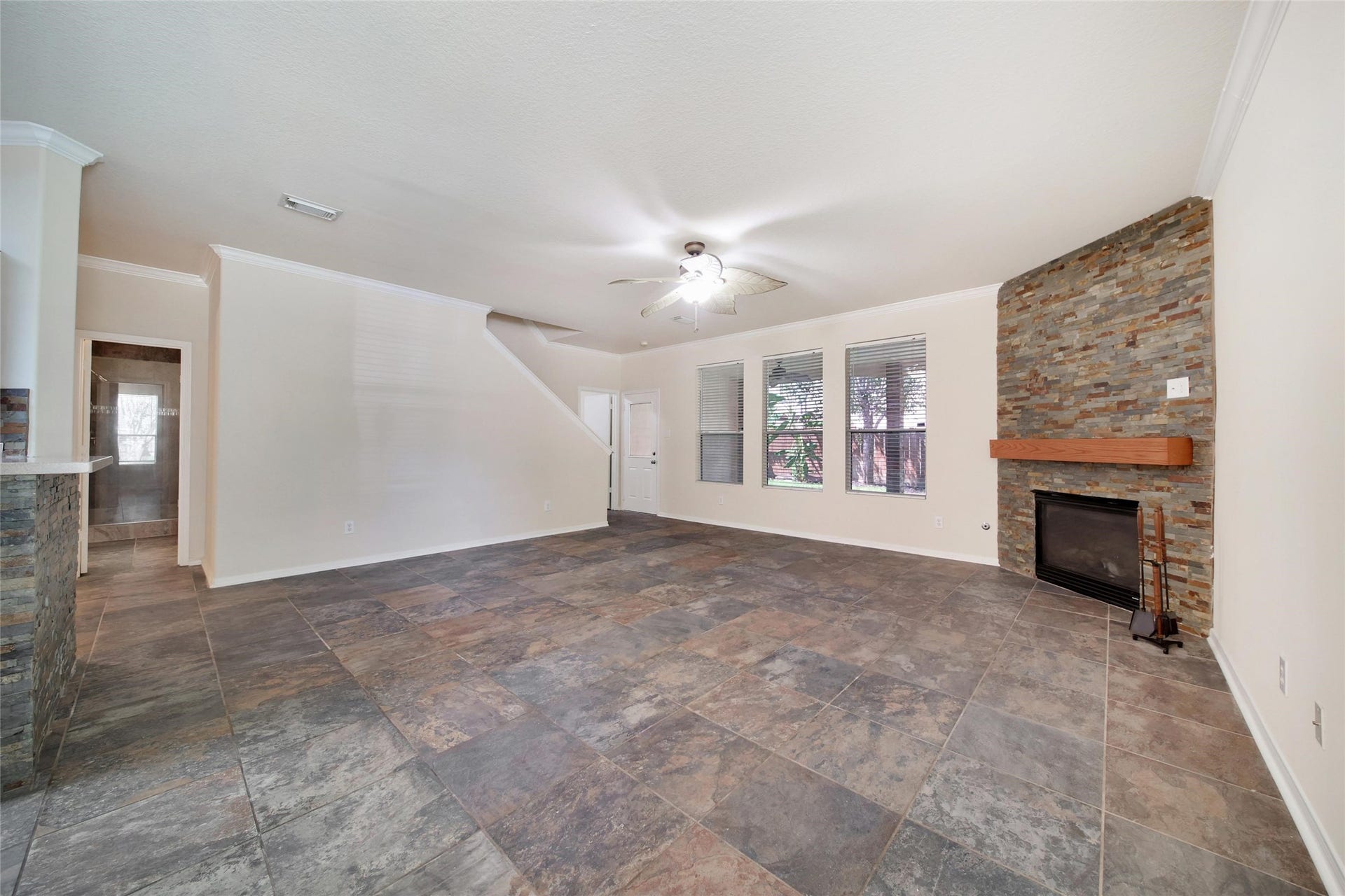 19302 Dawn Canyon Road, Houston, TX 77084 View to the living room with fancy tile and fireplace.