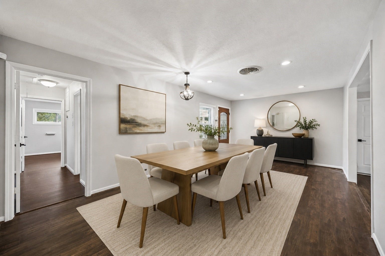 2214 Saxon Drive, Houston, TX 77018 Gather with ease in this beautifully staged dining room, where generous proportions create the perfect setting for everyday meals and memorable celebrations. Warm wood tones, soft neutral finishes, and an open connection to the adjacent living spaces make entertaining feel effortless. **Virtually staged**
