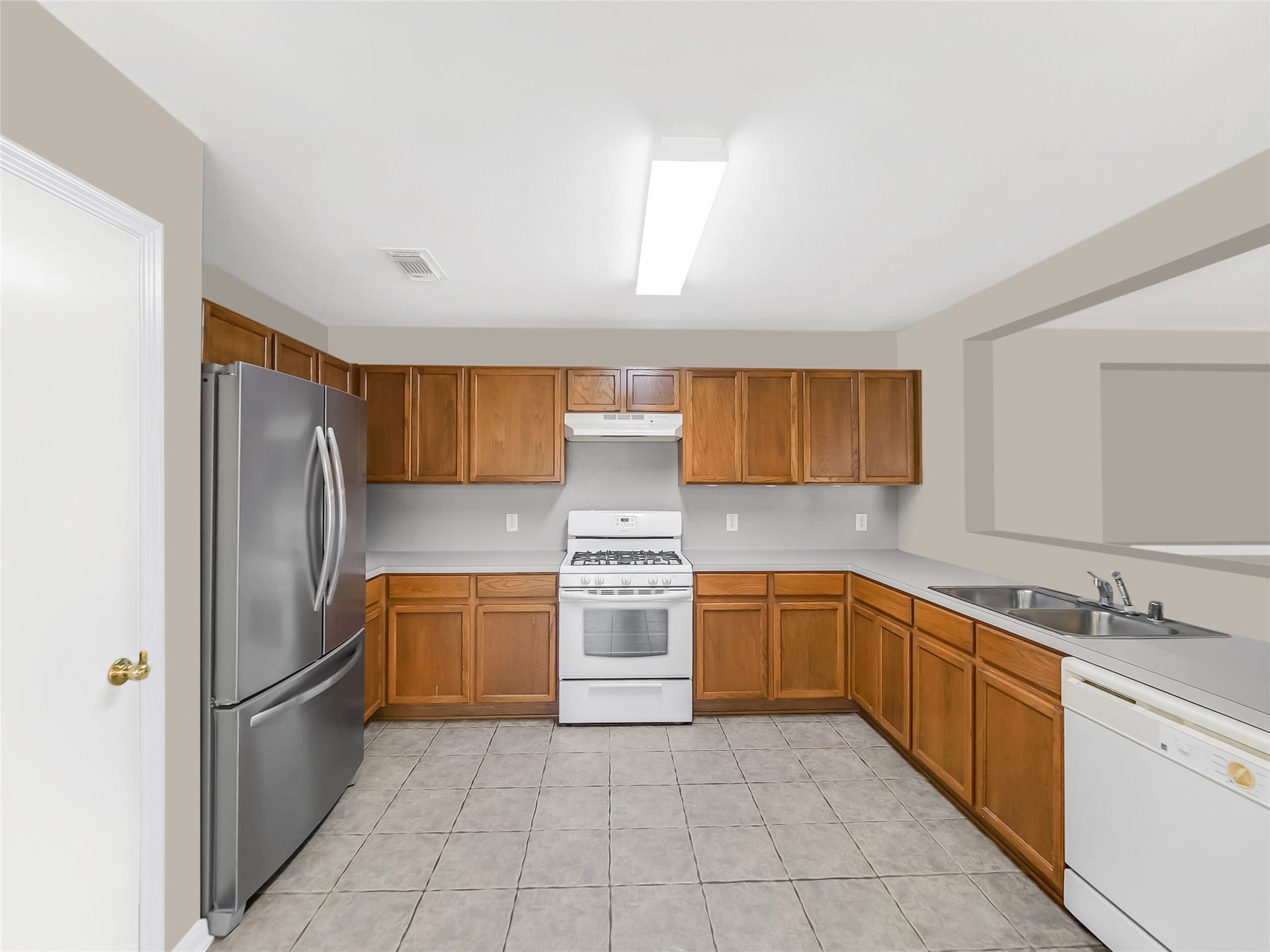20911 Harvest Terrace Lane, Spring, TX 77379 Kitchen adjacent to living space.