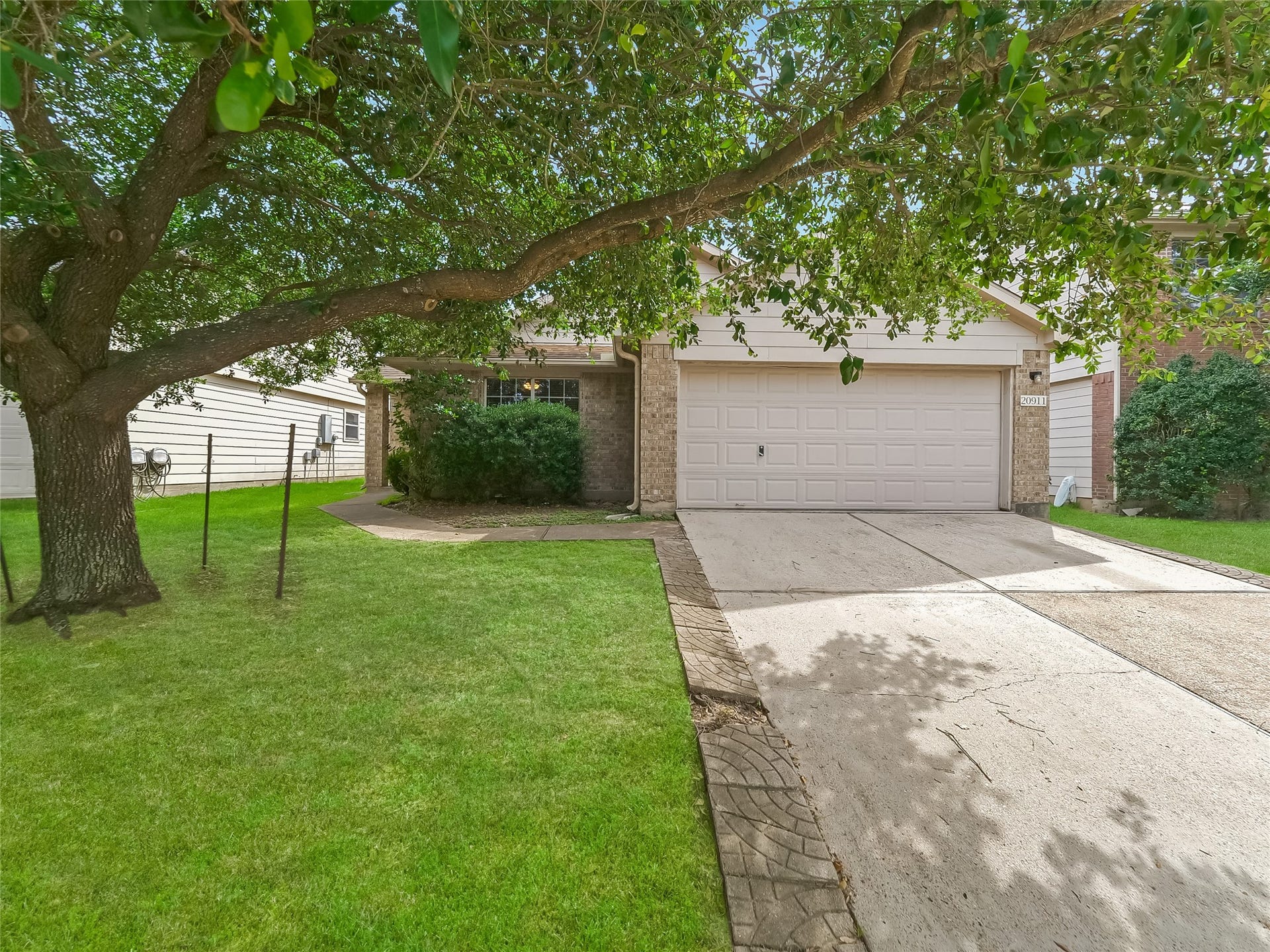 20911 Harvest Terrace Lane, Spring, TX 77379 Front exterior view of the property.